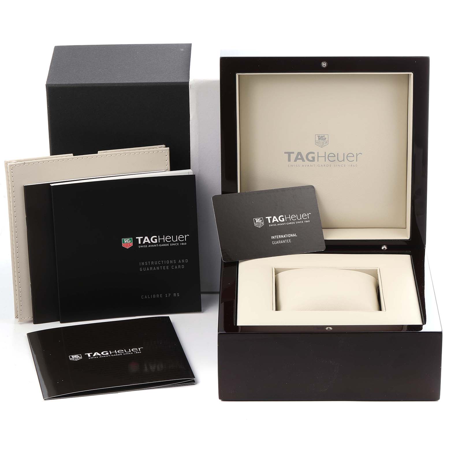 The image shows the Tag Heuer Carrera CAV511A.FC6225 Men
s Stainless Steel Black Dial CAV511A.FC6225 Men
s Stainless Steel Black Dial watch packaging, including the box, manuals, and guarantee card.