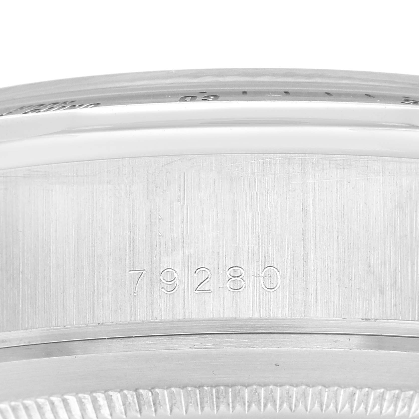 The image shows a close-up of the side of the Tudor Tiger 79280 Men
s Stainless Steel Blue Dial 79280 Men
s Stainless Steel Blue Dial model watch, featuring its engraved serial number.