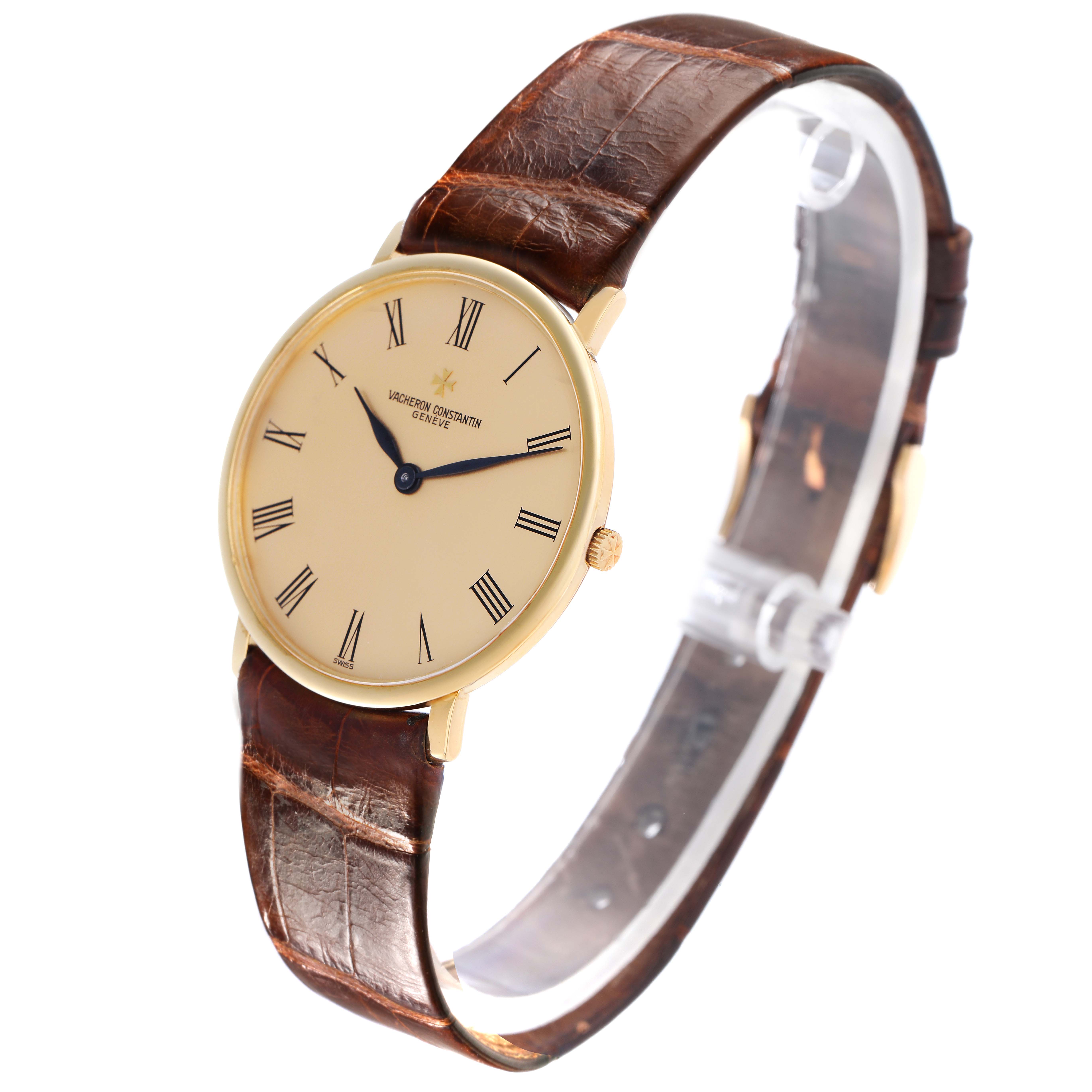 The Vacheron Constantin Patrimony 33216 Men
s Yellow Gold Champagne Dial 33216 Men
s Yellow Gold Champagne Dial watch is shown at a tilted angle, displaying the face with Roman numerals and brown leather strap.