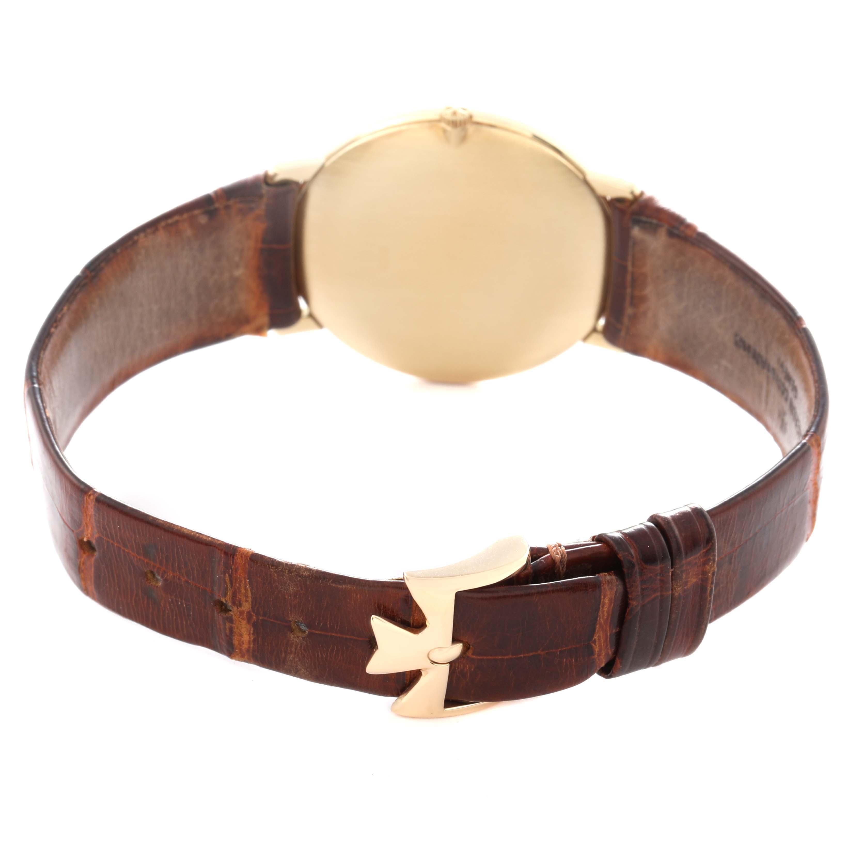 The Vacheron Constantin Patrimony 33216 Men
s Yellow Gold Champagne Dial 33216 Men
s Yellow Gold Champagne Dial watch is shown from the rear, highlighting the leather strap and clasp.