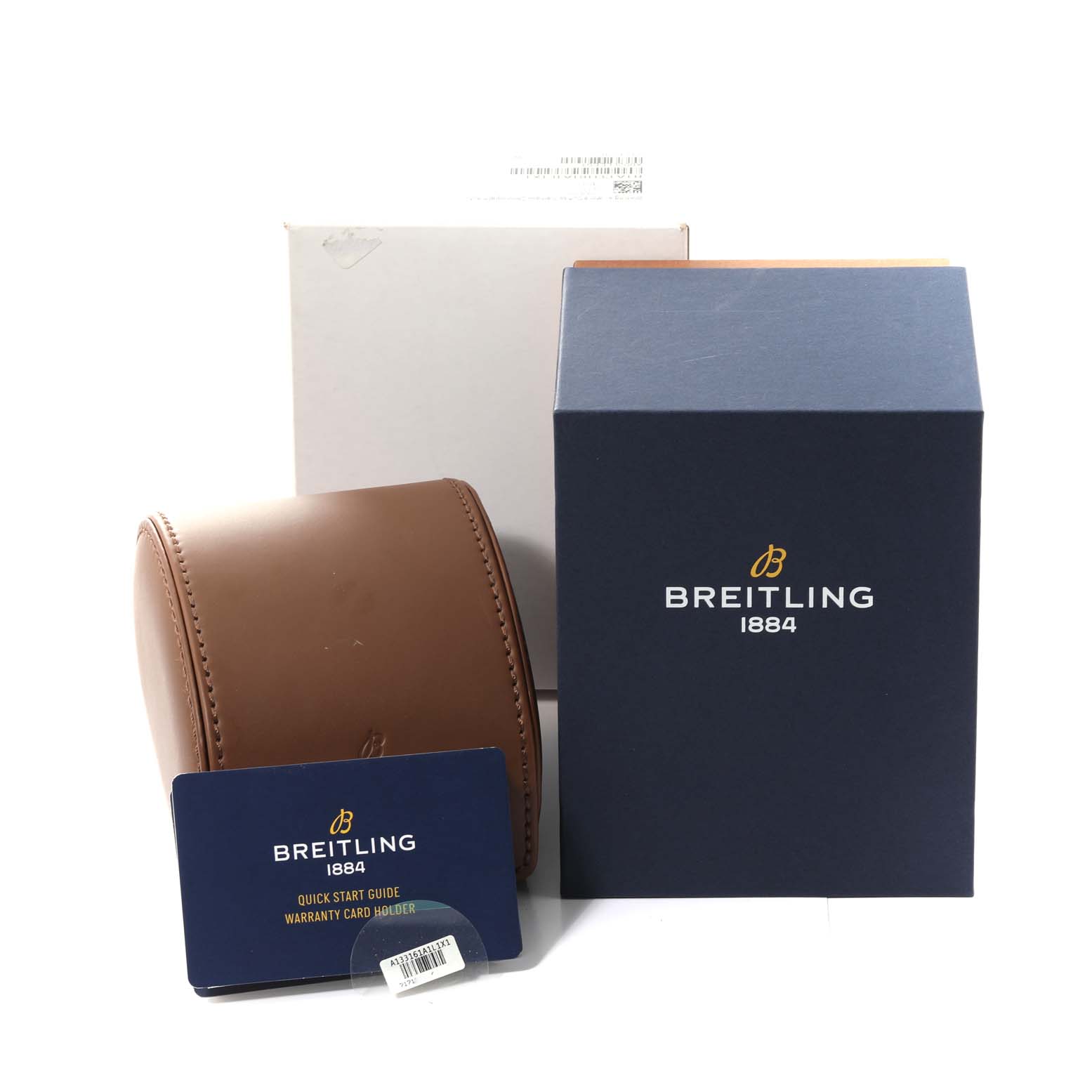 This image shows the packaging and accessories for a Breitling Aviator A13316 Men's Stainless Steel Green Dial A13316 Men's Stainless Steel Green Dial model, including a brown leather case, instruction card, and outer box.