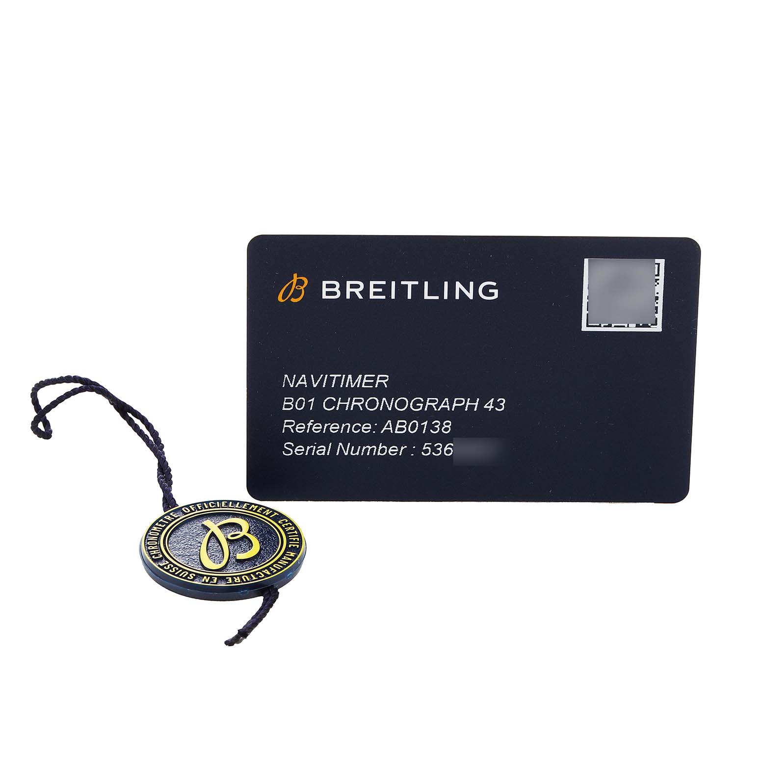 The image shows a Breitling Navitimer AB0138 Men's Stainless Steel Blue Dial B01 Chronograph 43 warranty card and a branded hang tag.