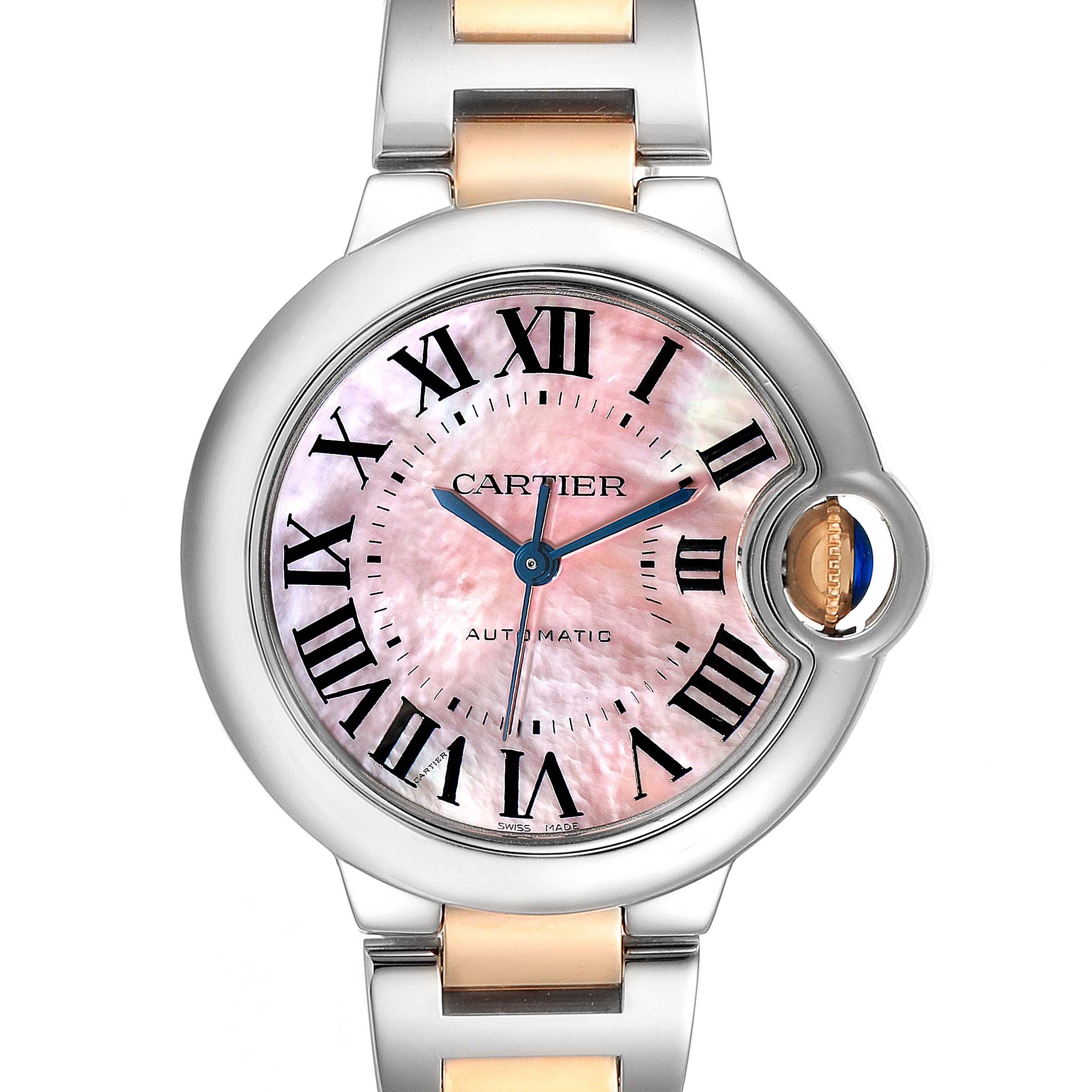 The image shows a front view of the Cartier Ballon Bleu W6920098 Women's Steel and Gold (two tone) Mother of Pearl Dial W6920098 Women's Steel and Gold (two tone) Mother of Pearl Dial watch, featuring a pink dial with Roman numerals and a steel and gold bracelet.