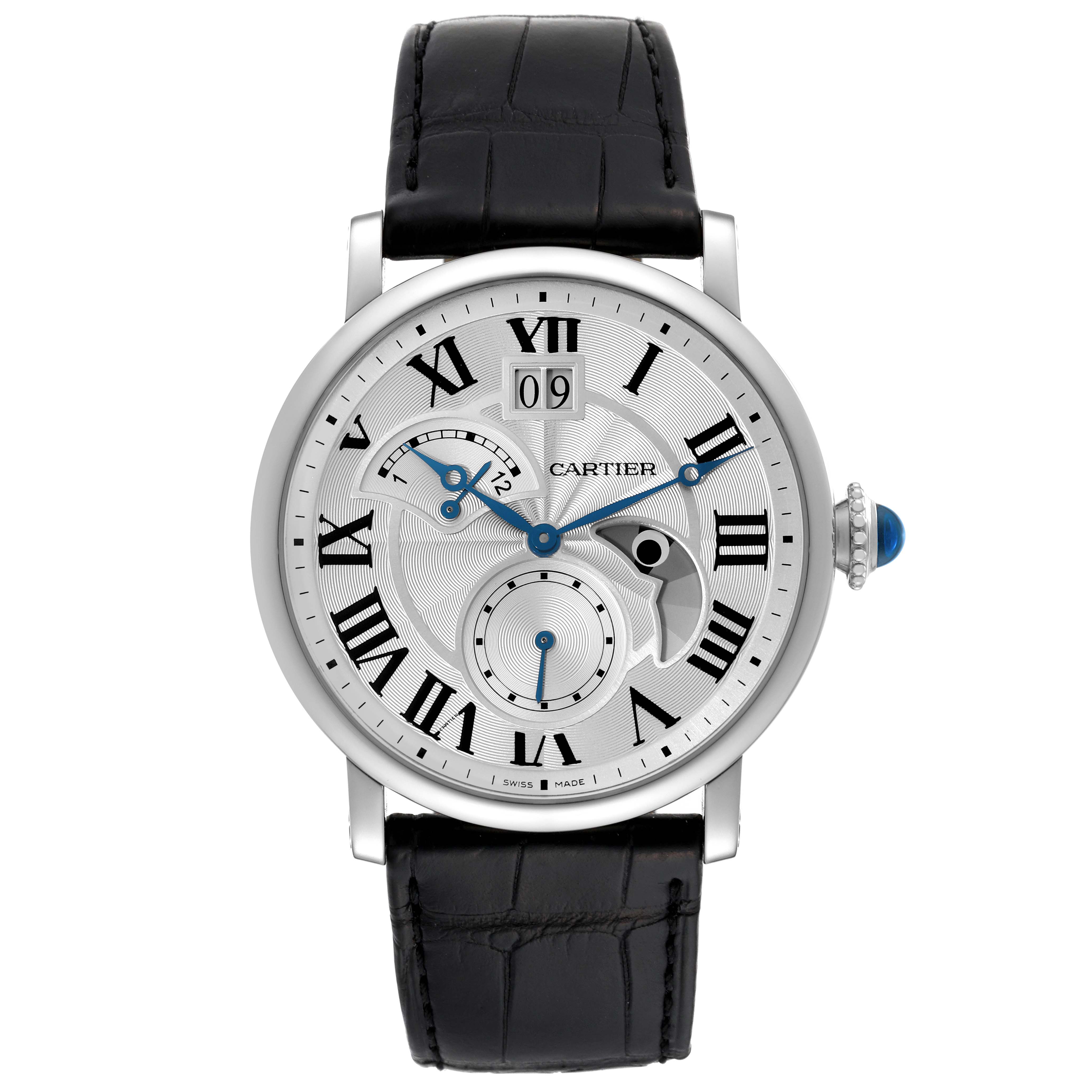 Front view of the Rotonde model by Cartier, showcasing the watch face, leather strap, and crown with a blue cabochon.