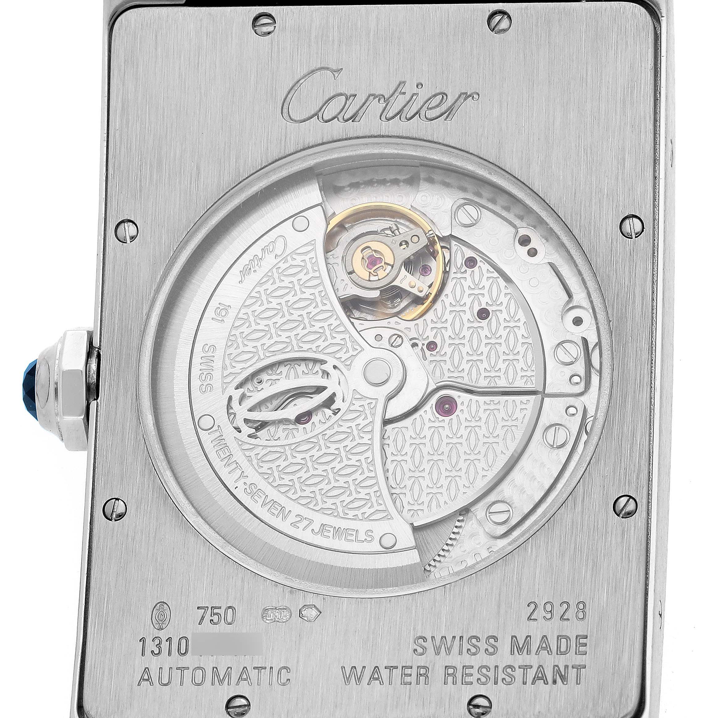 The image shows the back view of a Cartier Tank Américaine watch, highlighting its automatic movement and internal mechanics.