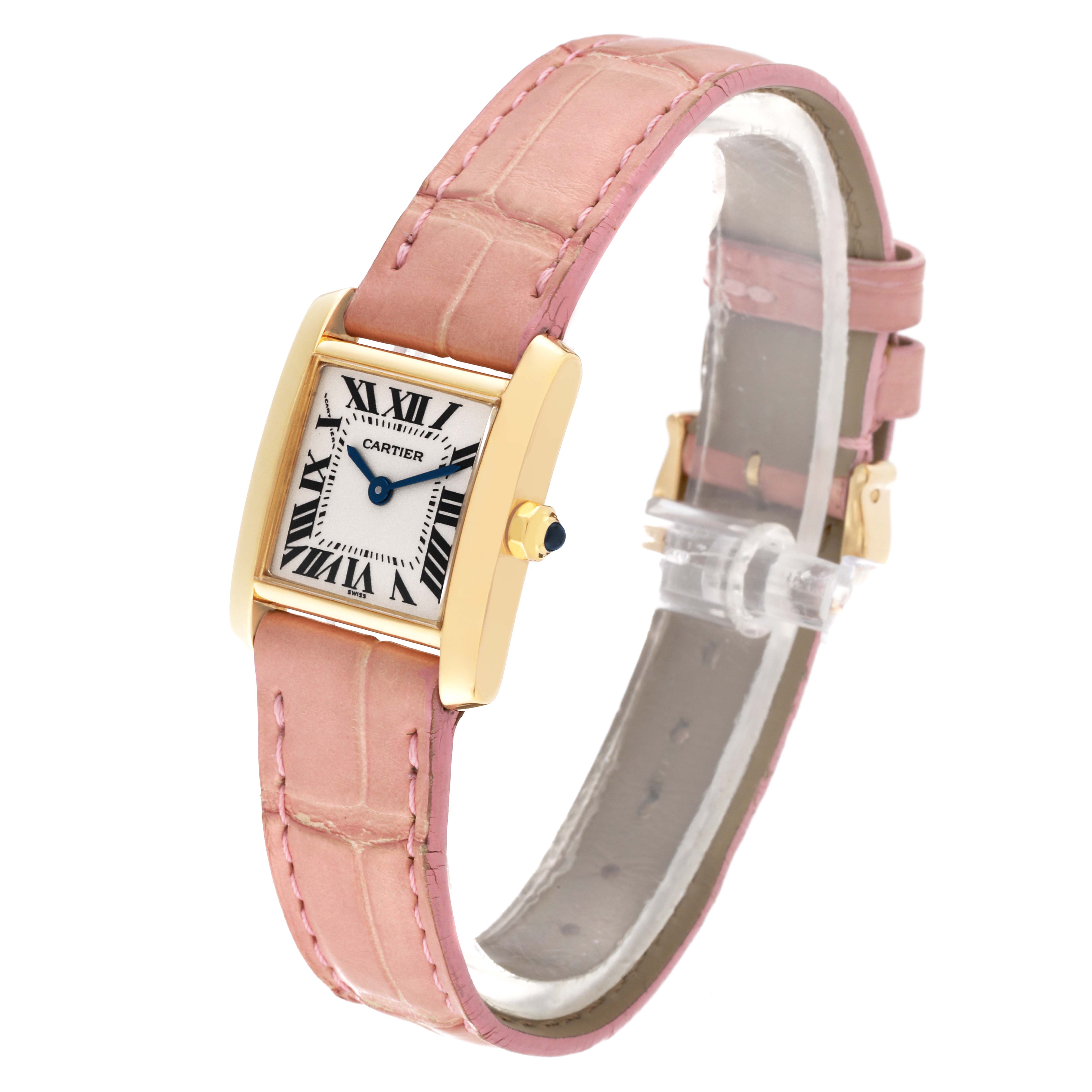 The image shows a Cartier Tank Francaise W5000256 Women
s Yellow Gold Silver Dial W5000256 Women
s Yellow Gold Silver Dial watch at a slight angle, highlighting its pink leather strap and rectangular gold case.
