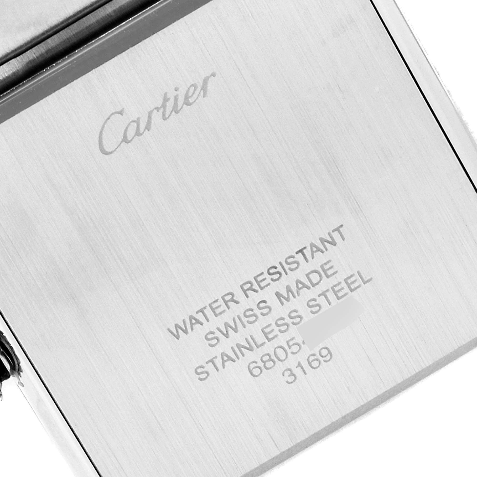 This image shows the back of a Cartier Tank Solo W5200014 Men's Stainless Steel Silver Dial W5200014 Men's Stainless Steel Silver Dial watch with engraved details about its specifications.