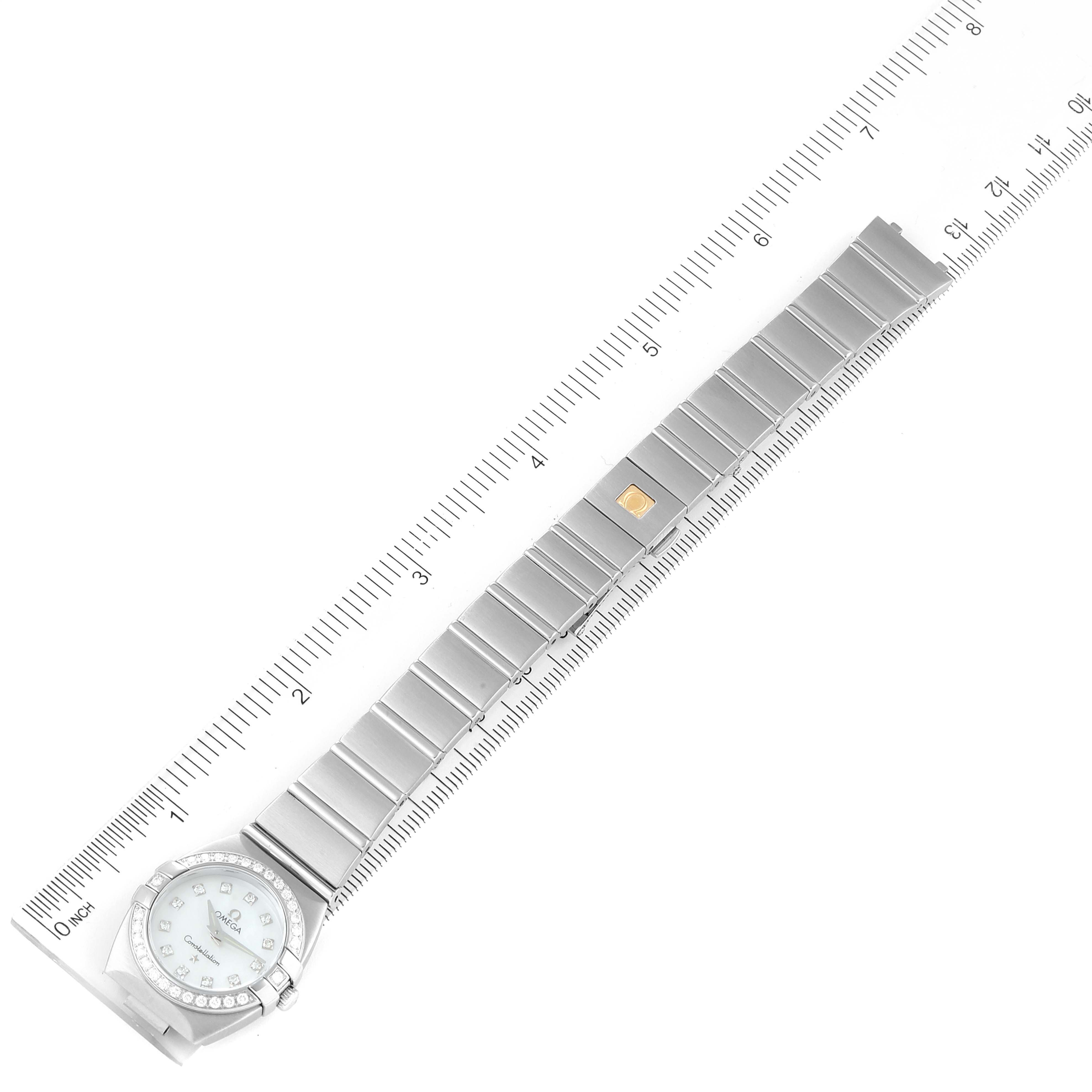 The Omega 123.15.24.60.57.001 Women
s Stainless Steel Mother of Pearl Dial 123.15.24.60.57.001 Women
s Stainless Steel Mother of Pearl Dial Constellation 24 MOP Diamond Ladies Watch 123.15.24.60.05.001 is shown flat, fully extended, with a ruler for scale.