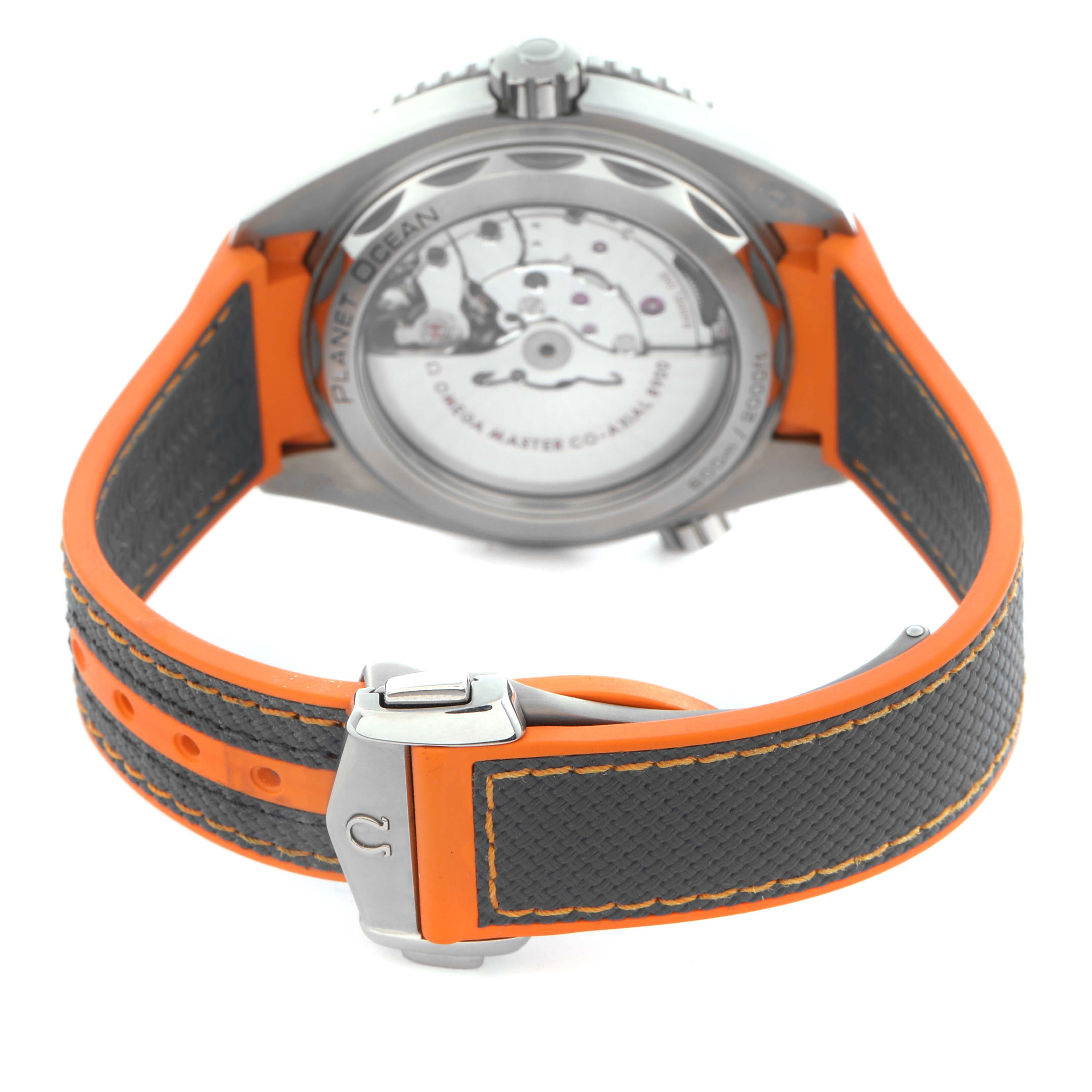 The image shows the back and clasp of an Omega Planet Ocean 215.92.44.21.99.001 Men
s Titanium Grey Dial 215.92.44.21.99.001 Men
s Titanium Grey Dial watch with an orange and black strap.