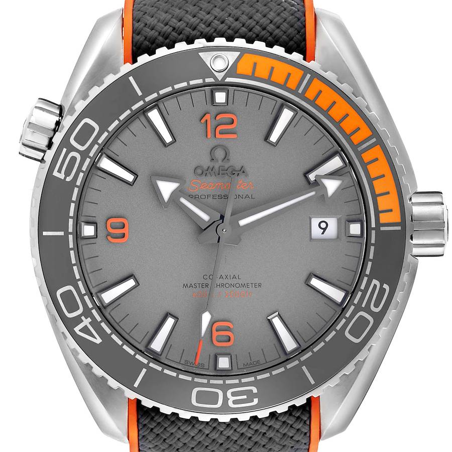 The Omega Planet Ocean watch is shown from the front, highlighting its gray dial, orange accents, and textured strap.