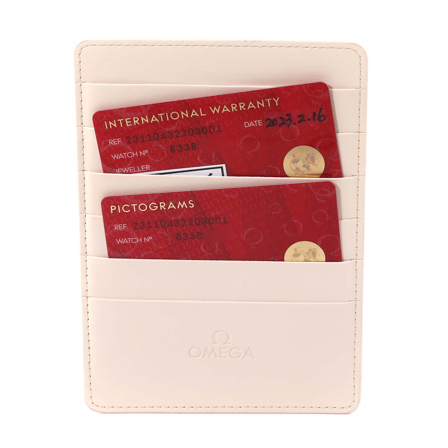 The image shows a cream-colored Omega cardholder with International Warranty and Pictograms cards for the Aqua Terra model.