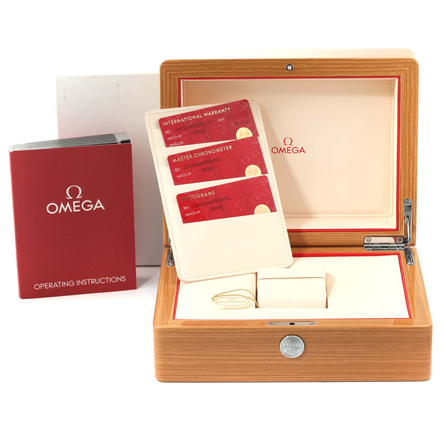 The image shows an Omega Aqua Terra 220.10.38.20.01.001 Men's Stainless Steel Black Dial 220.10.38.20.01.001 Men's Stainless Steel Black Dial watch box, operating instructions, warranty cards, and a small cushion for the watch.