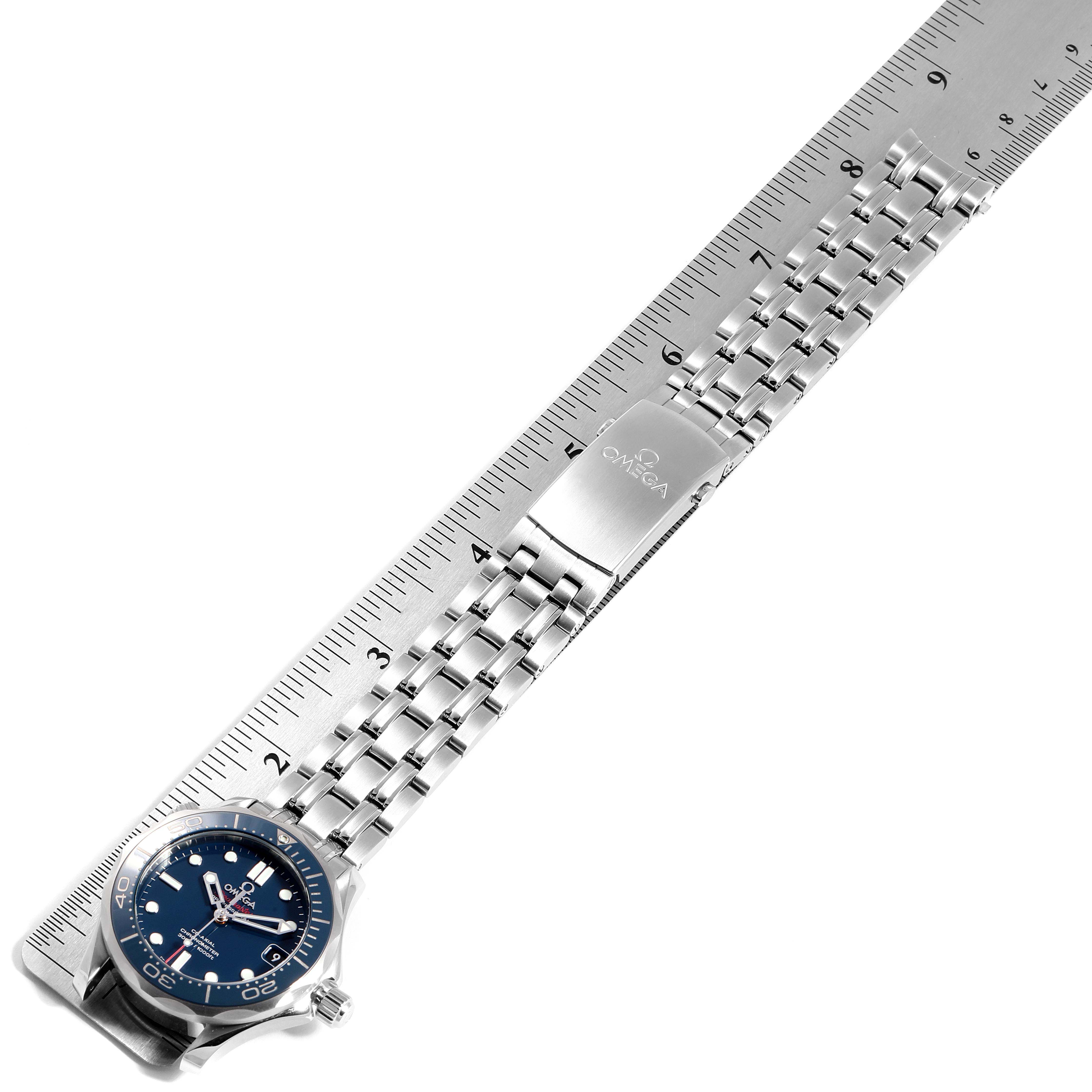 The image shows an Omega Seamaster 212.30.36.20.03.001 Men
s Stainless Steel Blue Dial 212.30.36.20.03.001 Men
s Stainless Steel Blue Dial watch laid flat against a ruler, highlighting the bracelet and clasp.