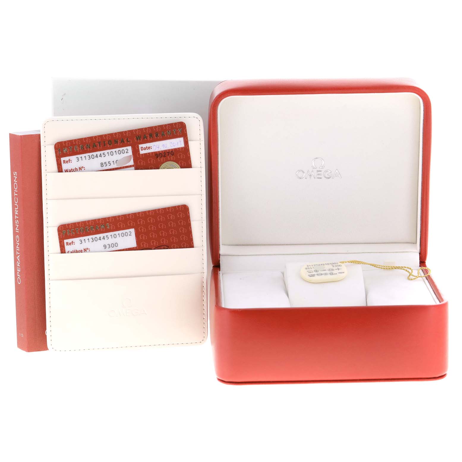 The image shows an Omega Speedmaster 311.30.44.51.01.002 Men
s Stainless Steel Black Dial 311.30.44.51.01.002 Men
s Stainless Steel Black Dial watch box, operating instructions, and warranty cards placed next to the open box.