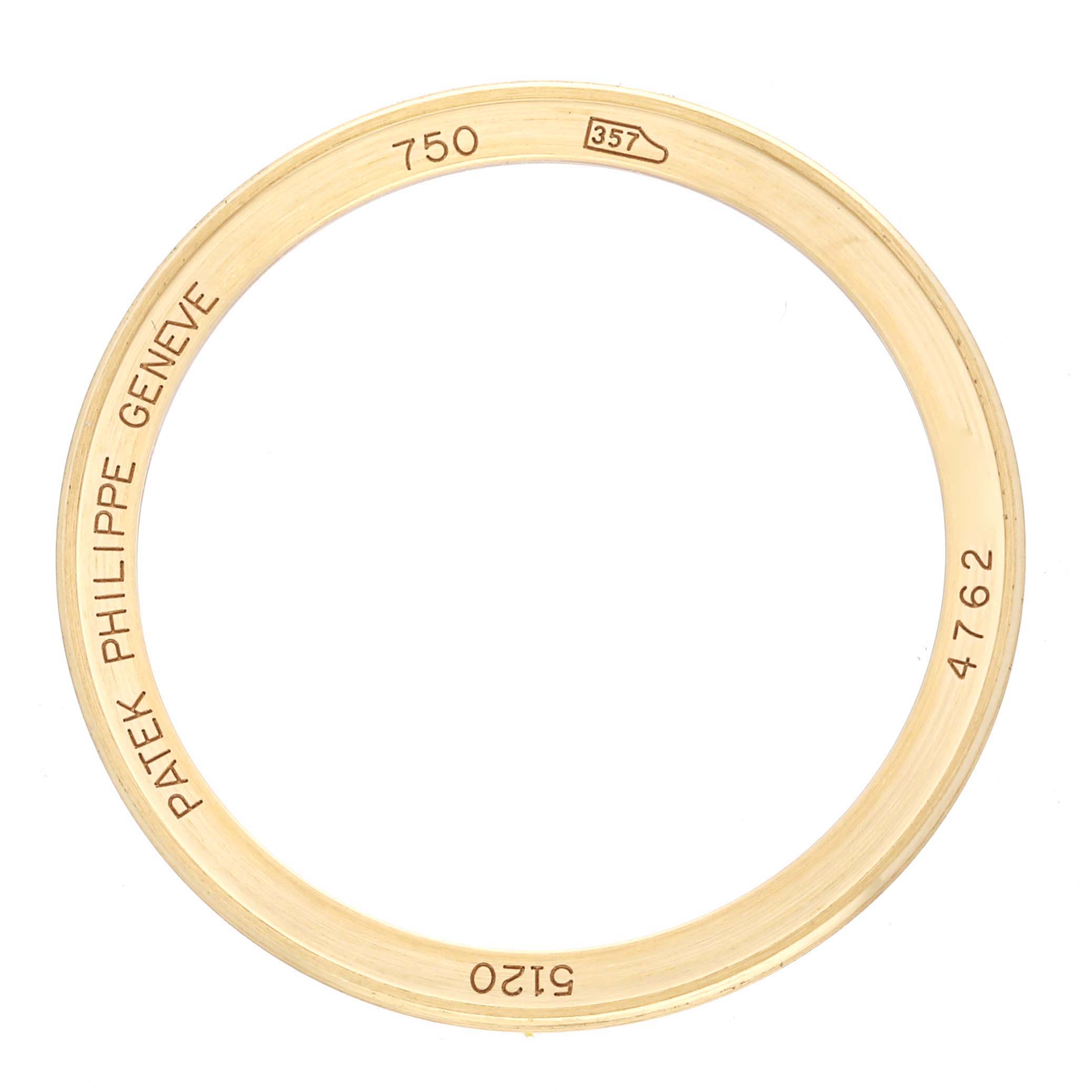 This image shows a gold bezel ring for the Patek Philippe Calatrava 5120J Men
s Yellow Gold White Dial 5120J Men
s Yellow Gold White Dial watch, viewed from an overhead angle.