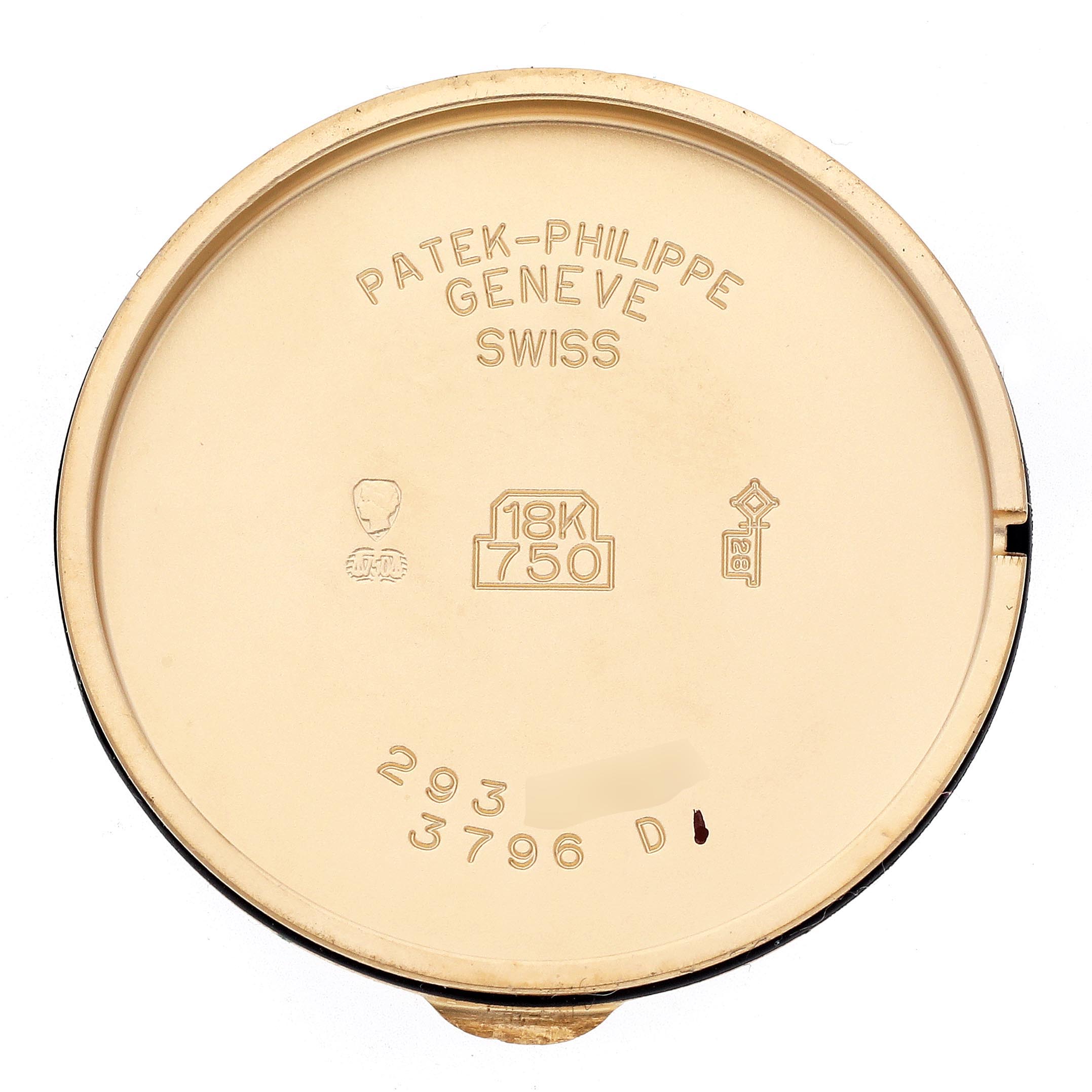 The image shows the inside of a Patek Philippe Calatrava 3796J Men
s Yellow Gold White Dial 3796J Men
s Yellow Gold White Dial watch case back, featuring engravings and hallmarks.