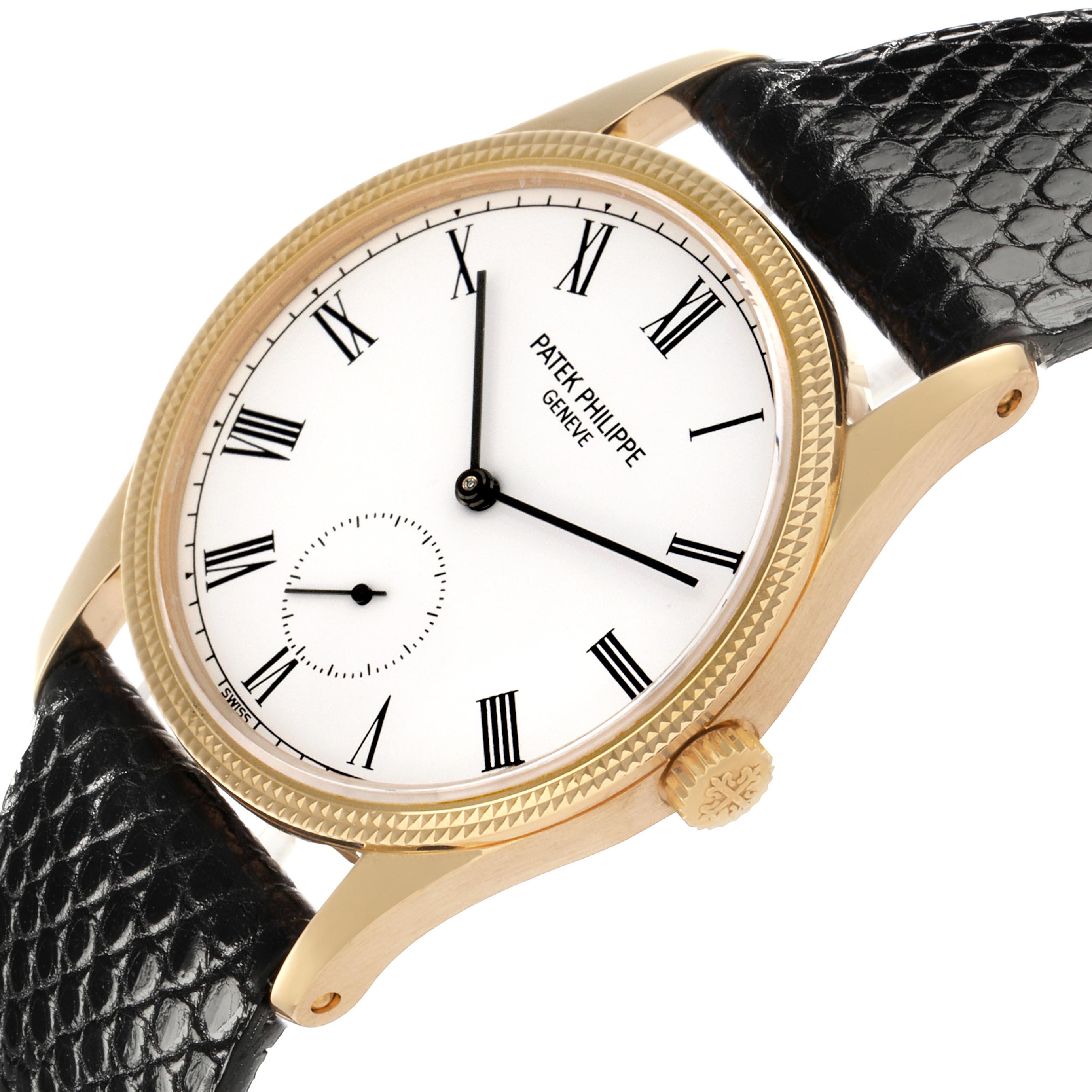 The image shows a Patek Philippe Calatrava 3796J Men
s Yellow Gold White Dial 3796J Men
s Yellow Gold White Dial watch at an angled view, highlighting the dial, bezel, crown, and leather strap.