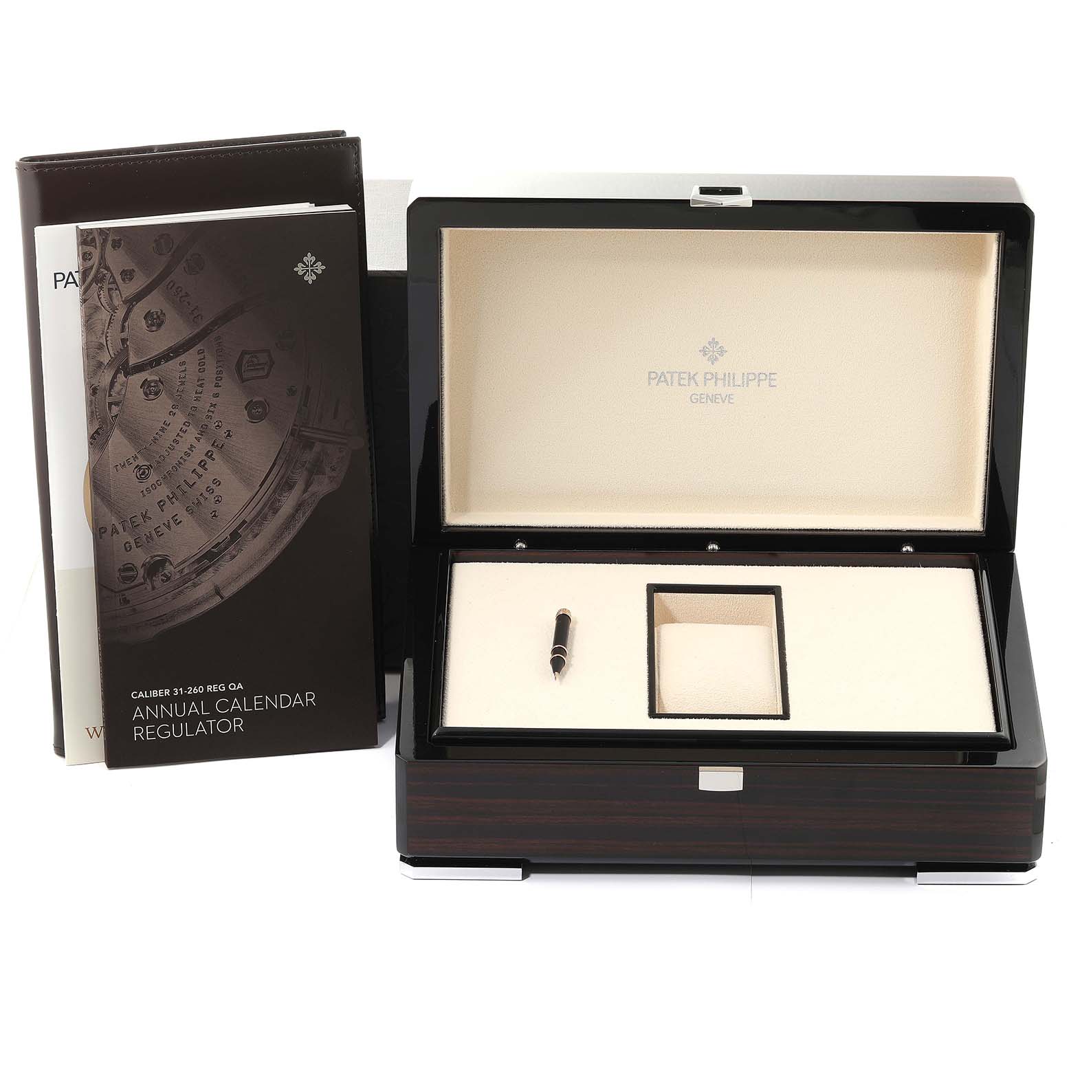 The image shows the storage box and manuals for a Complications model by Patek Philippe.