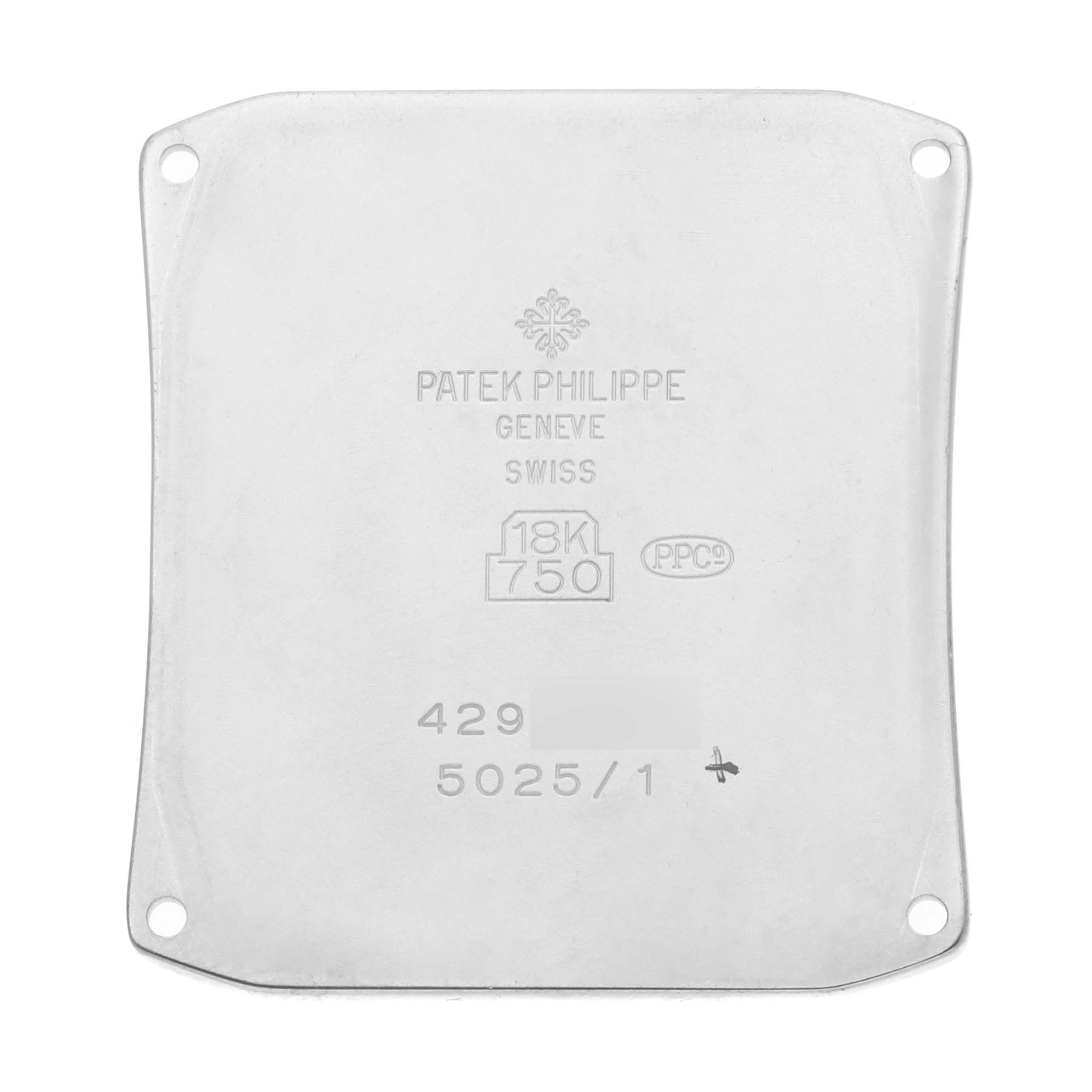 This image shows the back plate of a Patek Philippe Gondolo 5025G Men's White Gold White Dial 5025G Men's White Gold White Dial model watch, displaying its engravings and logos.