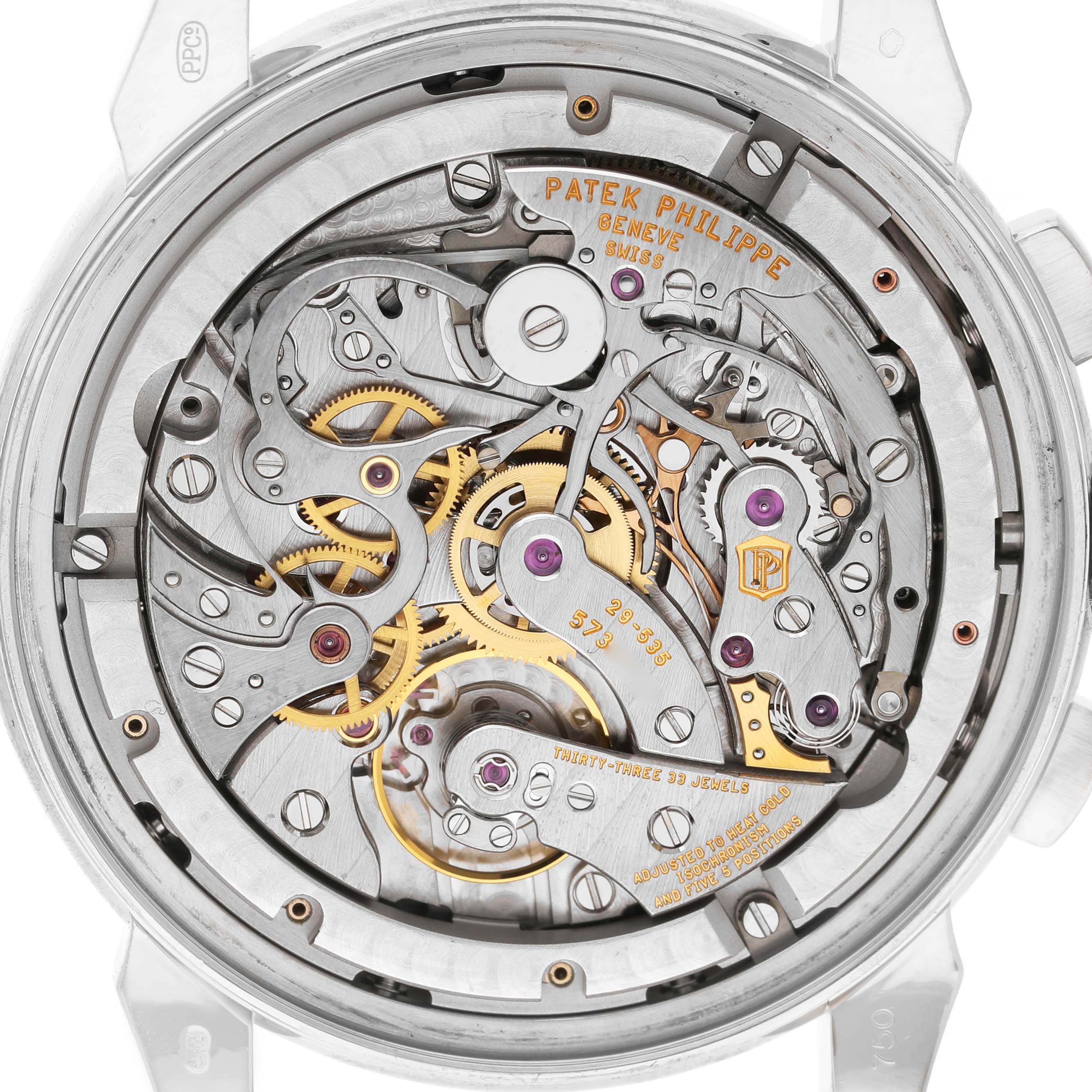 The Patek Philippe Complications 5270 Men's White Gold Silver Dial model is shown from the back, revealing its intricate movement and inner mechanisms.