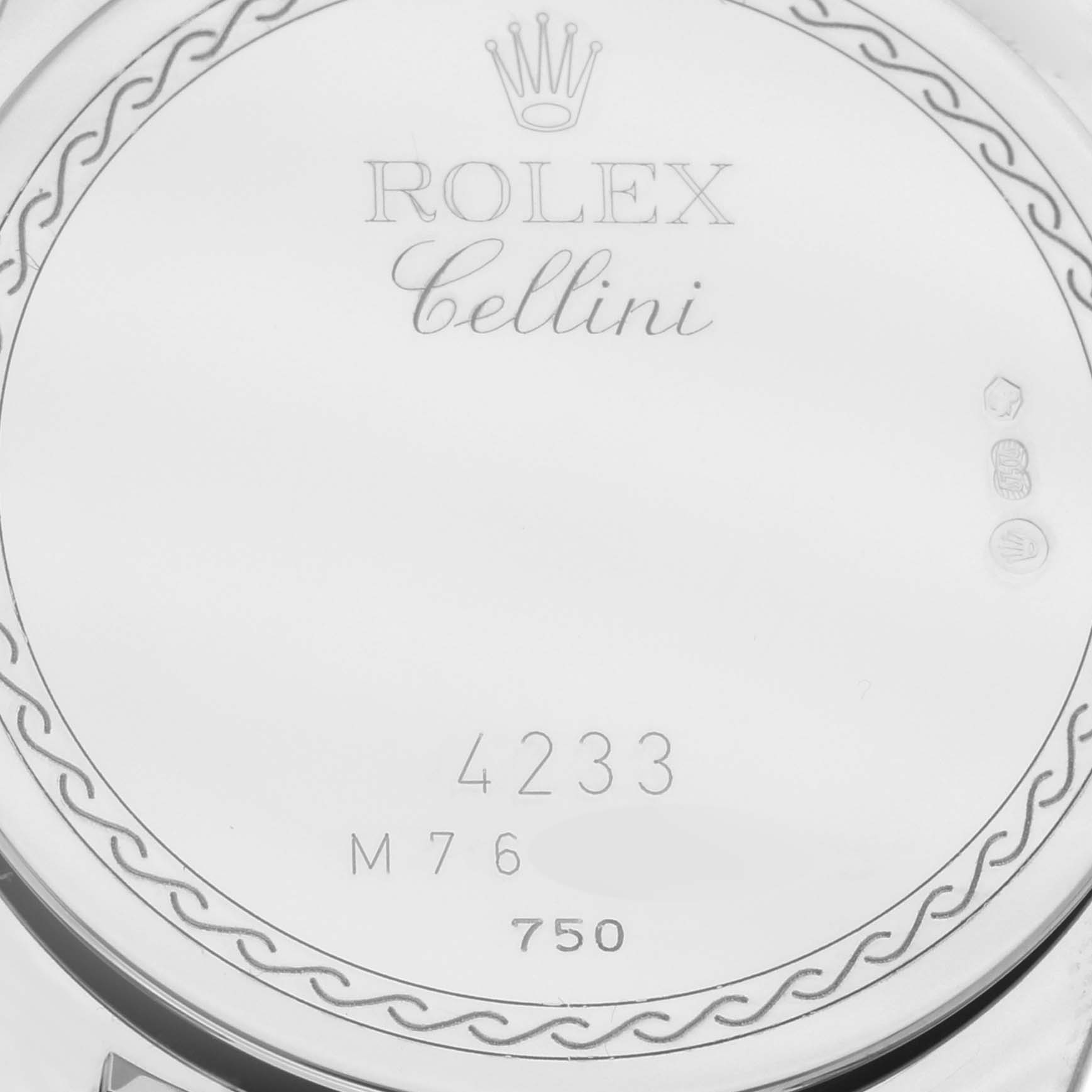 Close-up shot of the back case of the Rolex Cellini 4233/9 Men's White Gold Black Dial 4233/9 Men's White Gold Black Dial model showing the engravings and hallmarks.
