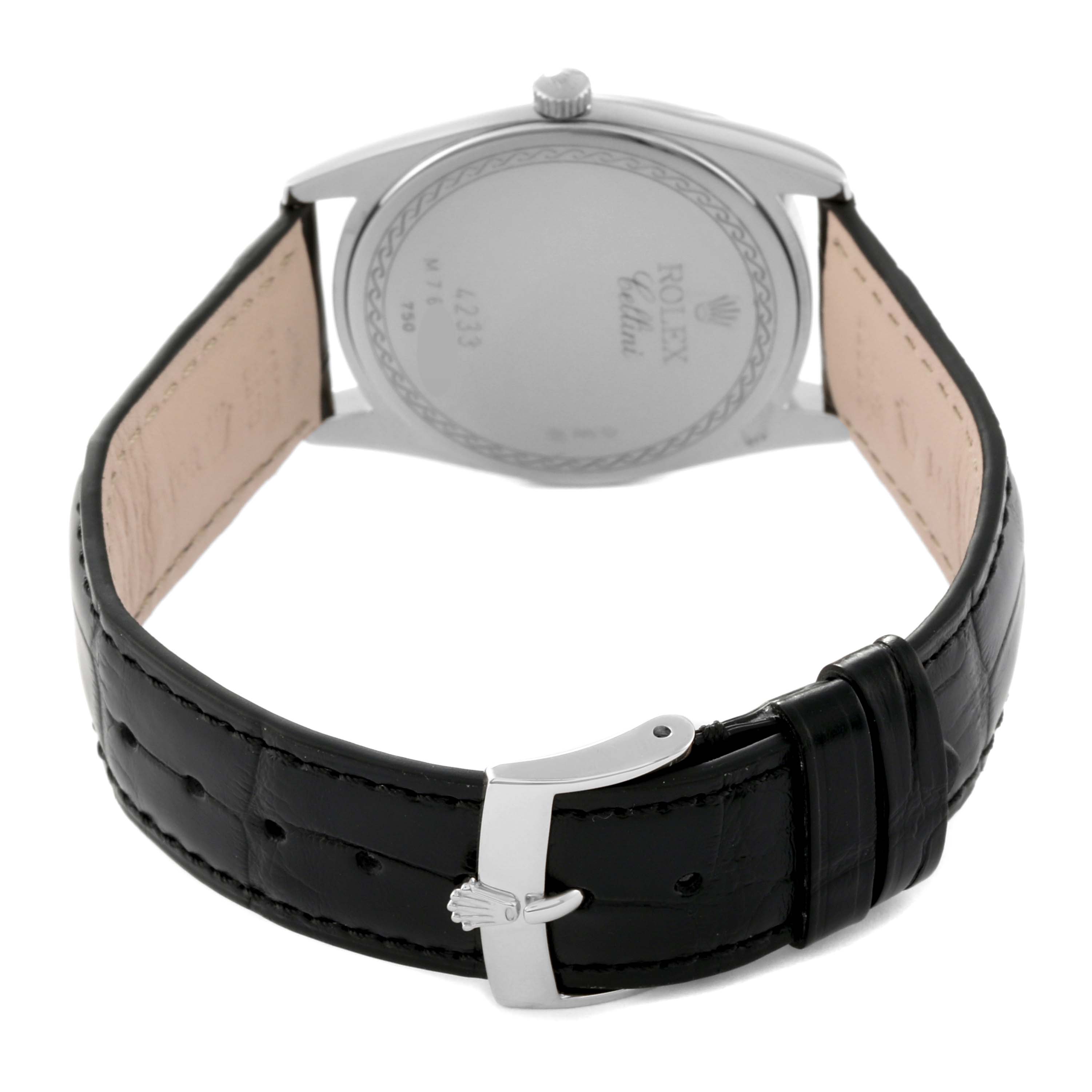 The image shows the back view of a Rolex Cellini 4233/9 Men's White Gold Black Dial 4233/9 Men's White Gold Black Dial watch, displaying its caseback, crown, and black leather strap with a clasp.