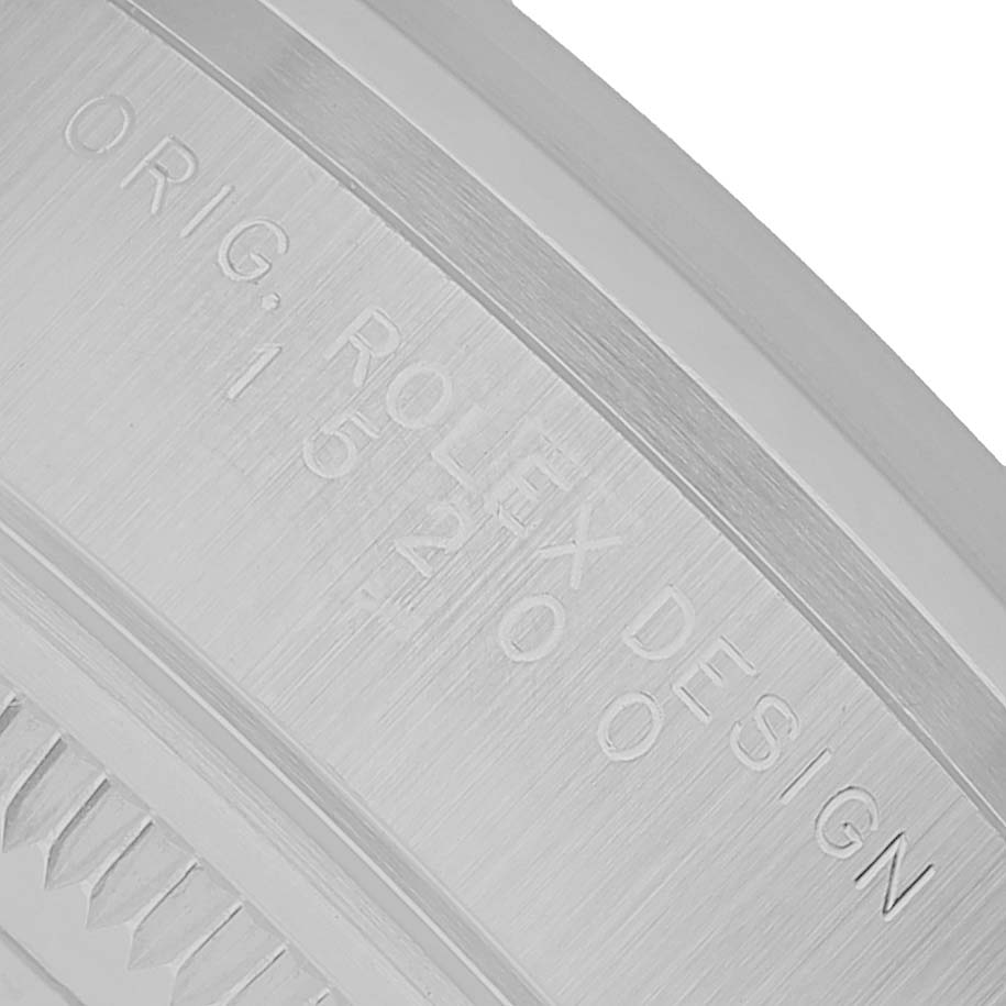 The image shows the inner bezel with engravings of the Rolex Date 15200 Men's Stainless Steel Blue Dial model.