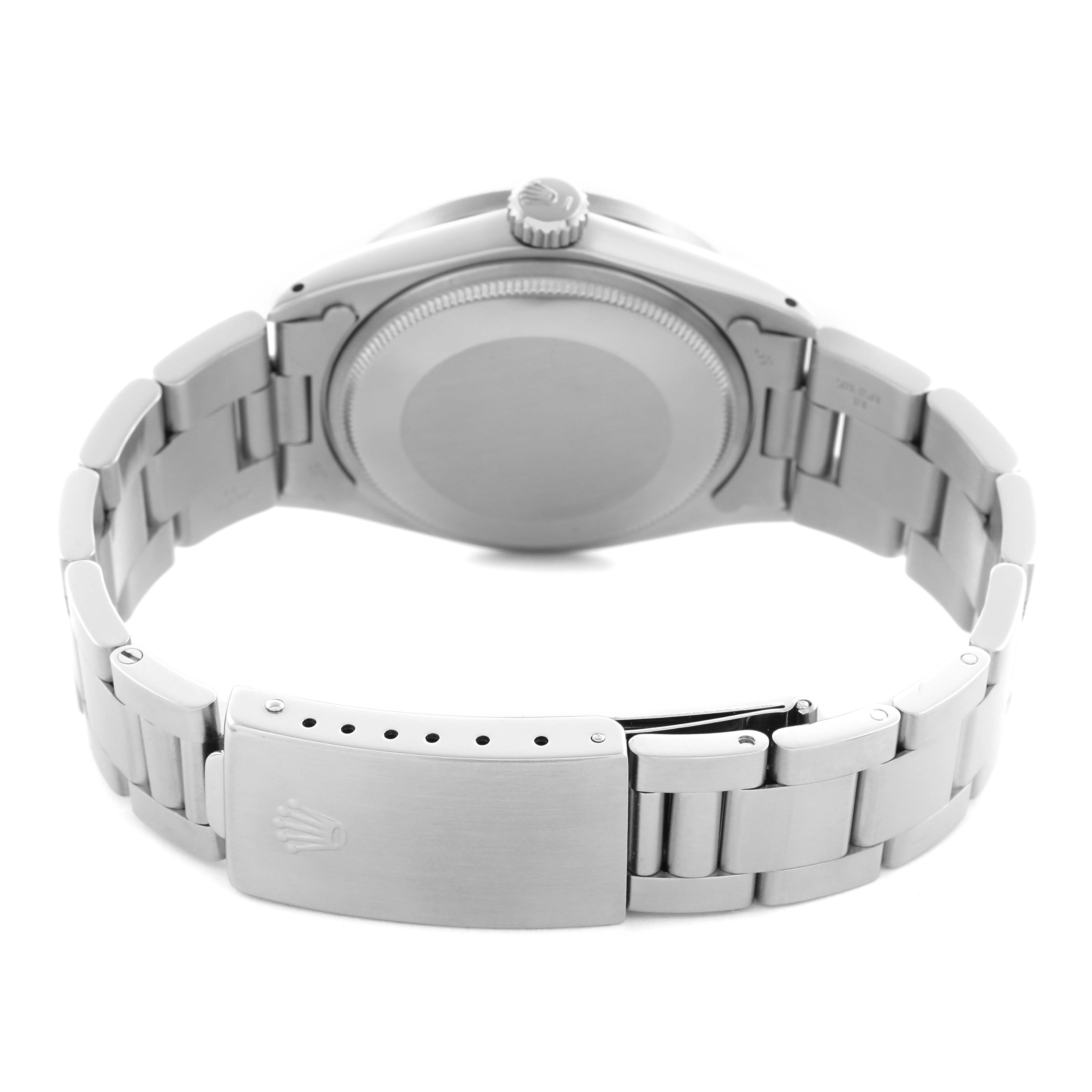 The image shows the back view of a Rolex Date model, highlighting the bracelet, clasp, and case back.