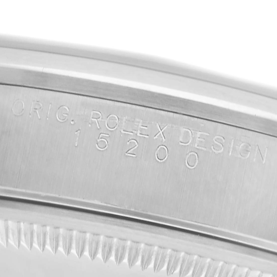 The image shows a close-up of the engraved inner bezel of a Rolex Date 15200 Men
s Stainless Steel Silver Dial 15200 Men
s Stainless Steel Silver Dial model.