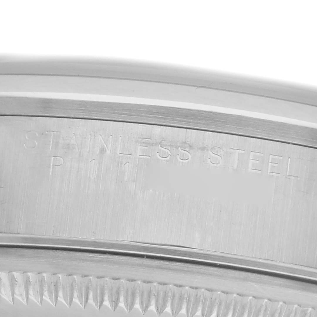 The image shows a close-up of the bezel and case edge of a Rolex Date 15200 Men
s Stainless Steel Silver Dial 15200 Men
s Stainless Steel Silver Dial model, showcasing the stainless steel engraving.