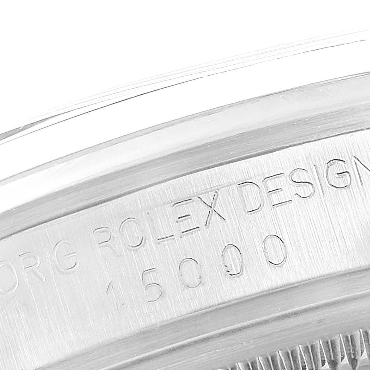 This image shows a close-up of the serial number and "Rolex Design" engraving on the case back of the Rolex Vintage Collection 15000 Men's Stainless Steel Silver Dial 15000 Men's Stainless Steel Silver Dial model.