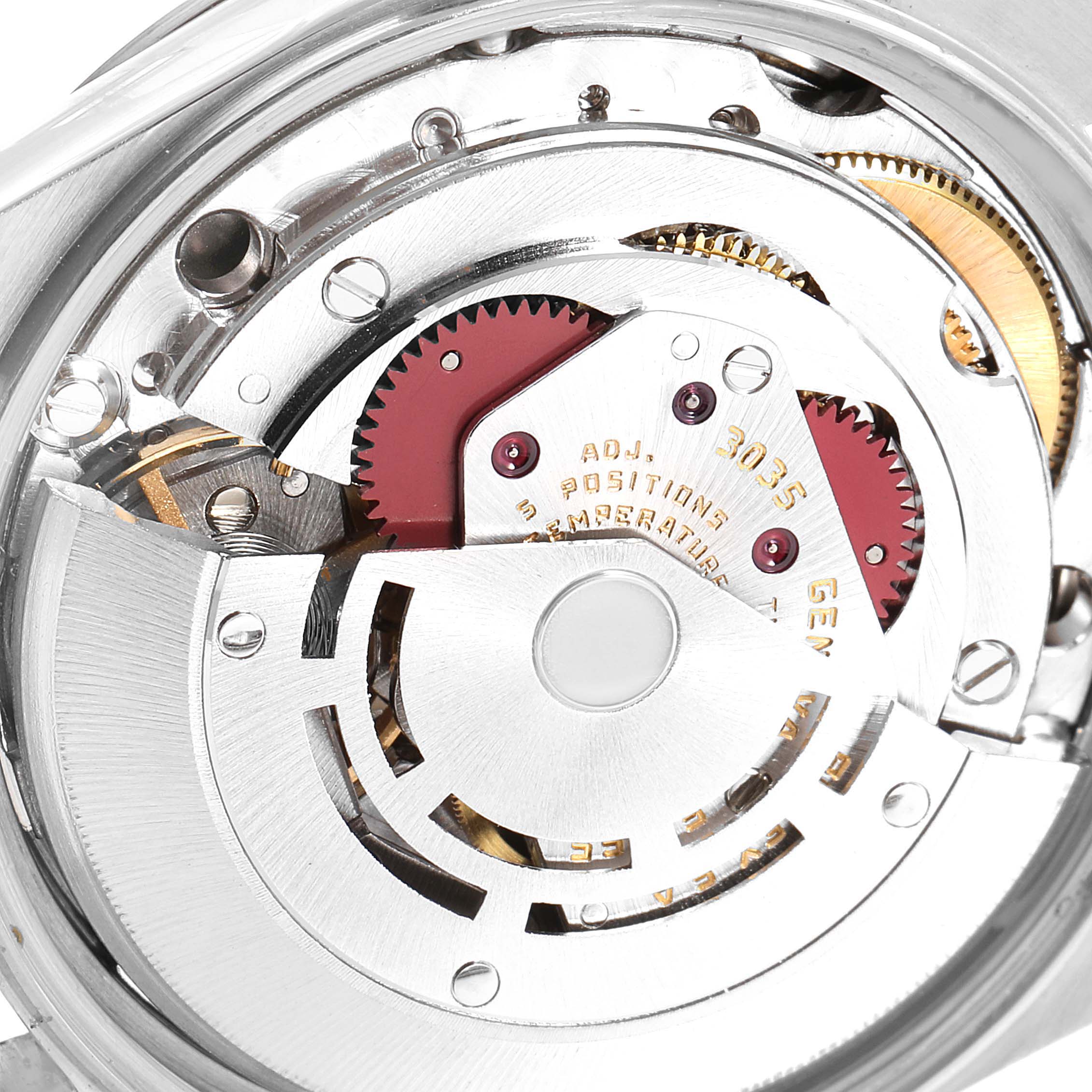 The image shows the intricate inner mechanism of a Vintage Collection Rolex watch from a macro angle.