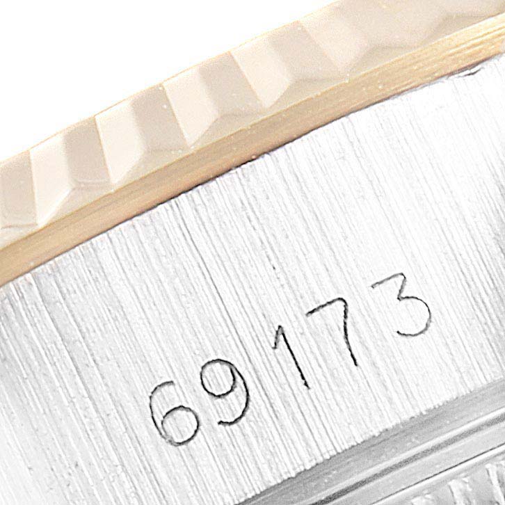 The image shows a close-up of the case side of a Rolex Datejust 69173 Women's Steel and Gold (two tone) Champagne Dial 69173 Women's Steel and Gold (two tone) Champagne Dial watch, displaying its serial number: 69173.