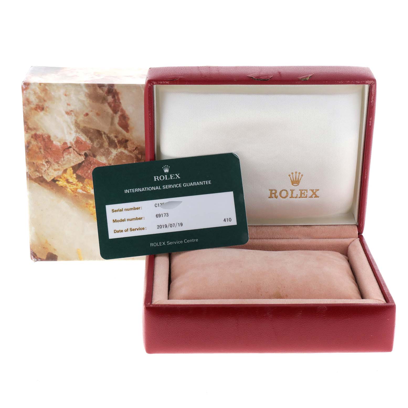 The image shows a Rolex Datejust 69173 Women's Steel and Gold (two tone) Champagne Dial 69173 Women's Steel and Gold (two tone) Champagne Dial model box with an international service guarantee card.