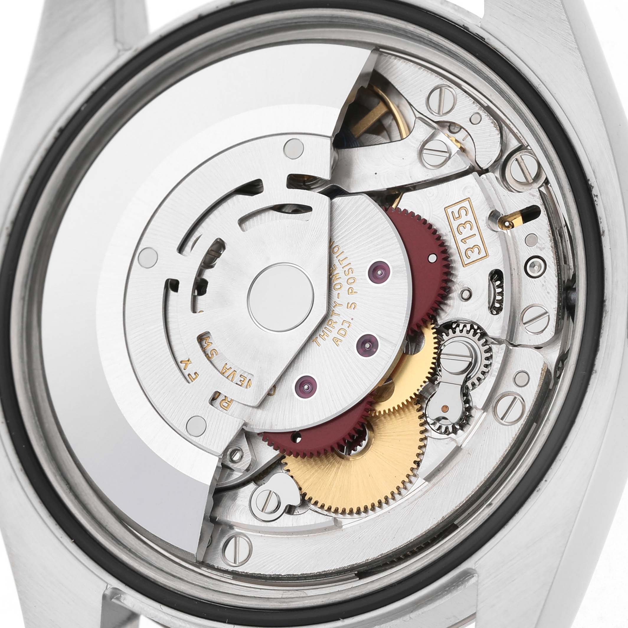 The image shows a detailed view of the Rolex Datejust 116234 Men's Stainless Steel Silver Dial model's movement and inner mechanism from the back.
