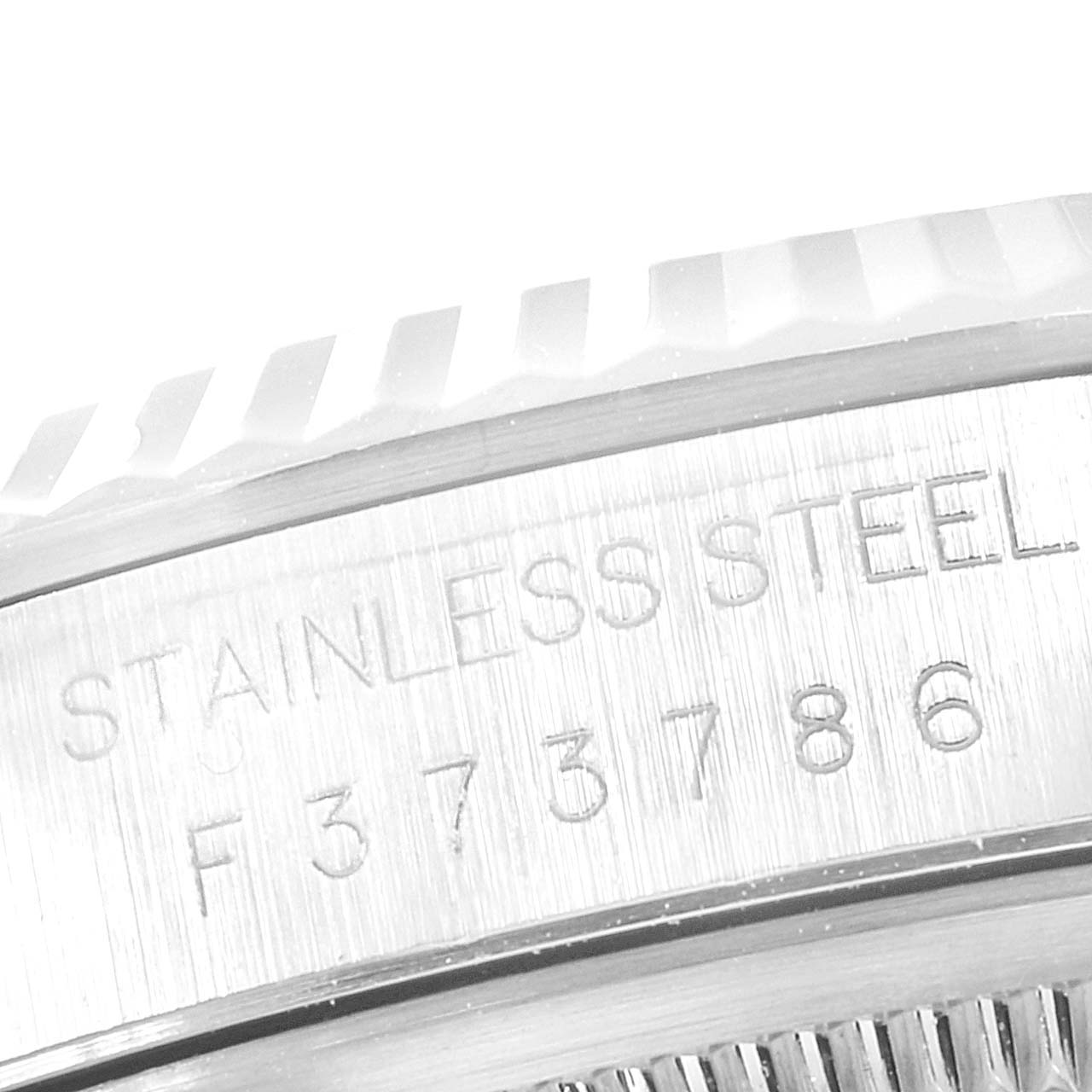 The image shows a close-up of the stainless steel section of a Rolex Datejust 16234 Women's Stainless Steel Blue Dial 16234 Women's Stainless Steel Blue Dial watch case with a visible serial number.