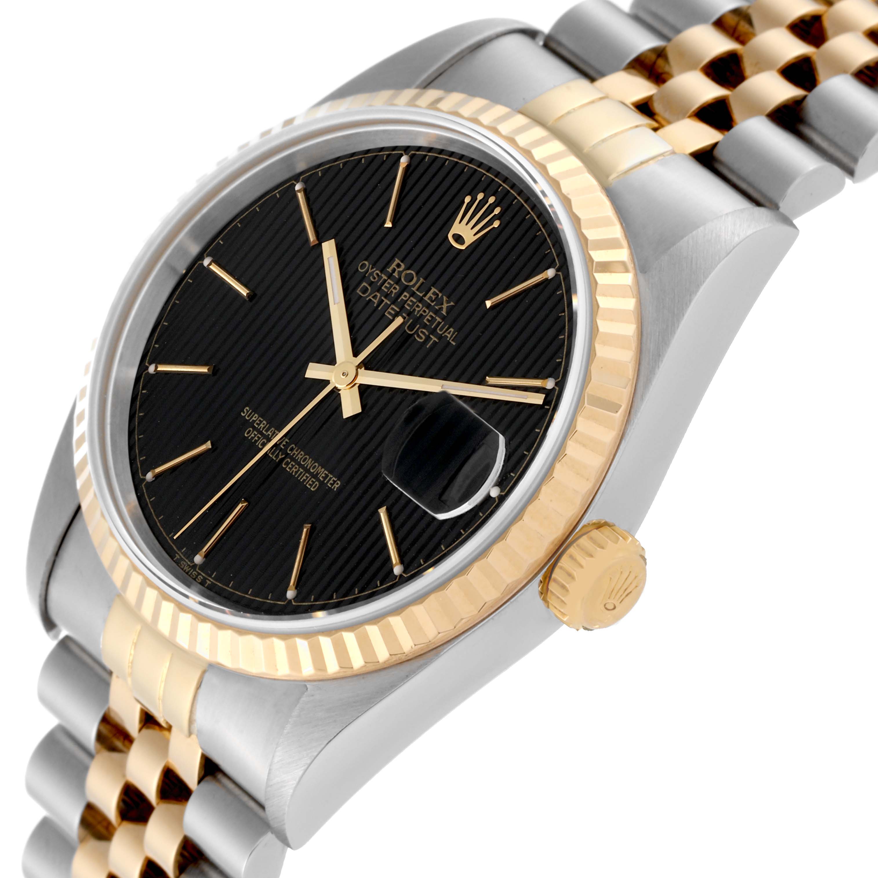 The image shows a close-up, angled view of the Rolex Datejust 16233 Men's Steel and Gold (two tone) Black Dial 16233 Men's Steel and Gold (two tone) Black Dial watch, focusing on the black dial, gold fluted bezel, and jubilee bracelet.