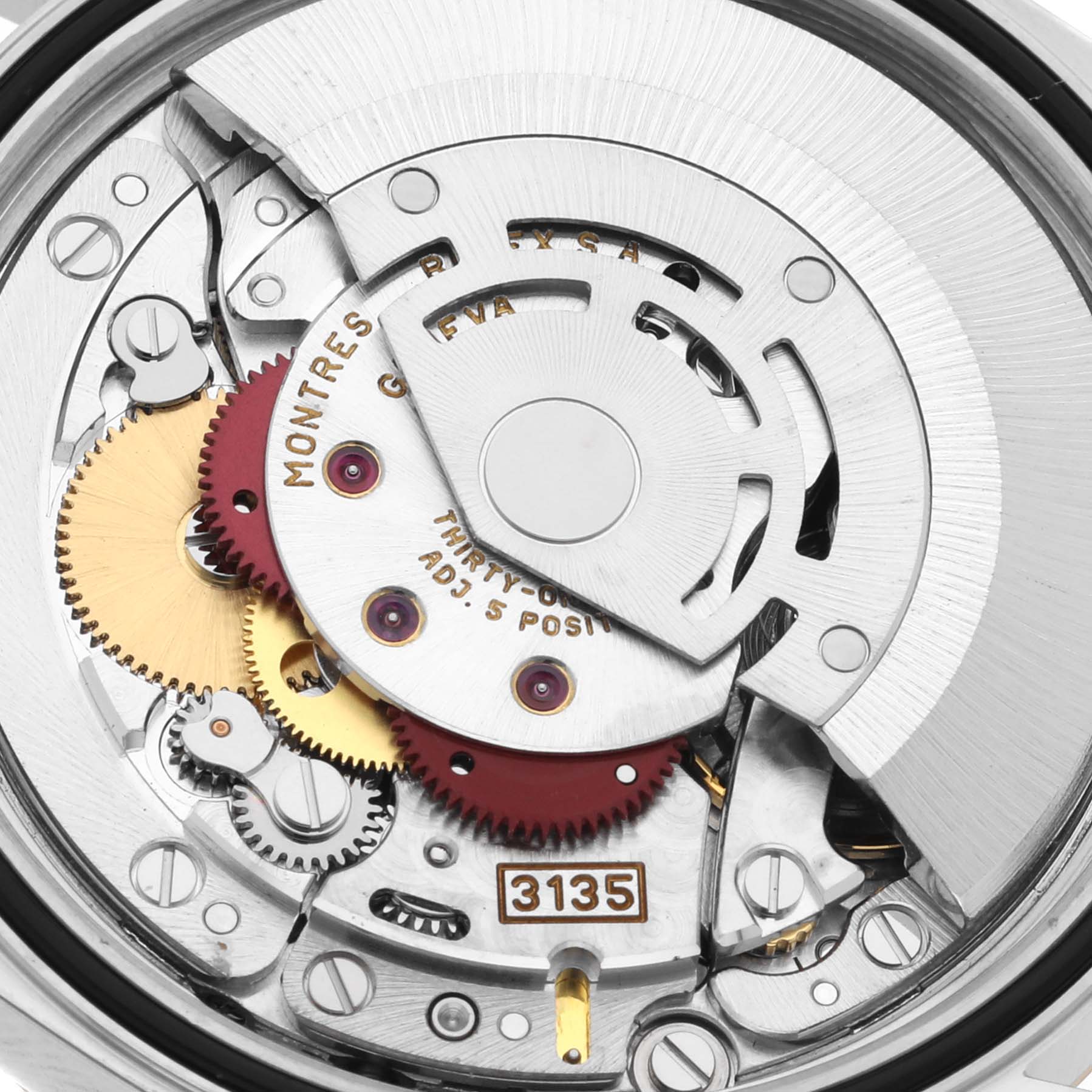 This is a close-up view of the Rolex Datejust 16233 Men's Steel and Gold (two tone) Black Dial 16233 Men's Steel and Gold (two tone) Black Dial watch's movement, showcasing gears and the rotor.