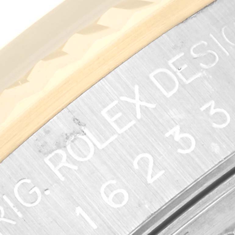 This image shows a close-up of the model engraving on the case side of a Rolex Datejust 16233 Men's Steel and Gold (two tone) Black Dial 16233 Men's Steel and Gold (two tone) Black Dial watch.