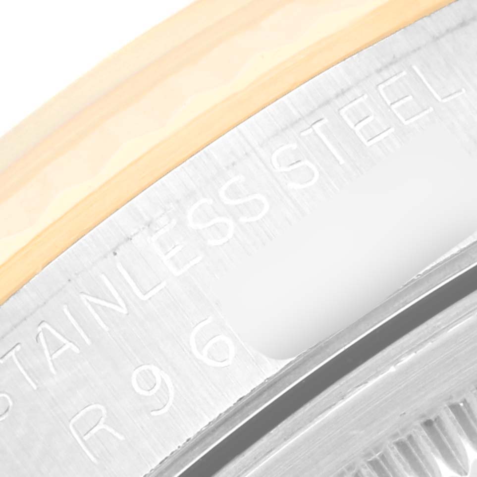 This close-up image shows part of the case back and the outer edge, with "Stainless Steel" engraved on a Rolex Datejust 16233 Men's Steel and Gold (two tone) White Dial 16233 Men's Steel and Gold (two tone) White Dial model.