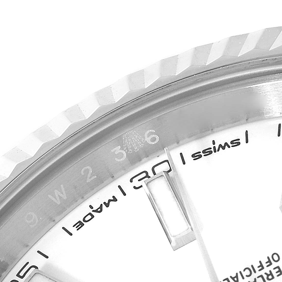 This close-up angle of the Rolex Datejust 41 126334 Men's Stainless Steel White Dial 126334 Men's Stainless Steel White Dial model shows the fluted bezel and part of the watch dial with "Swiss Made" text.