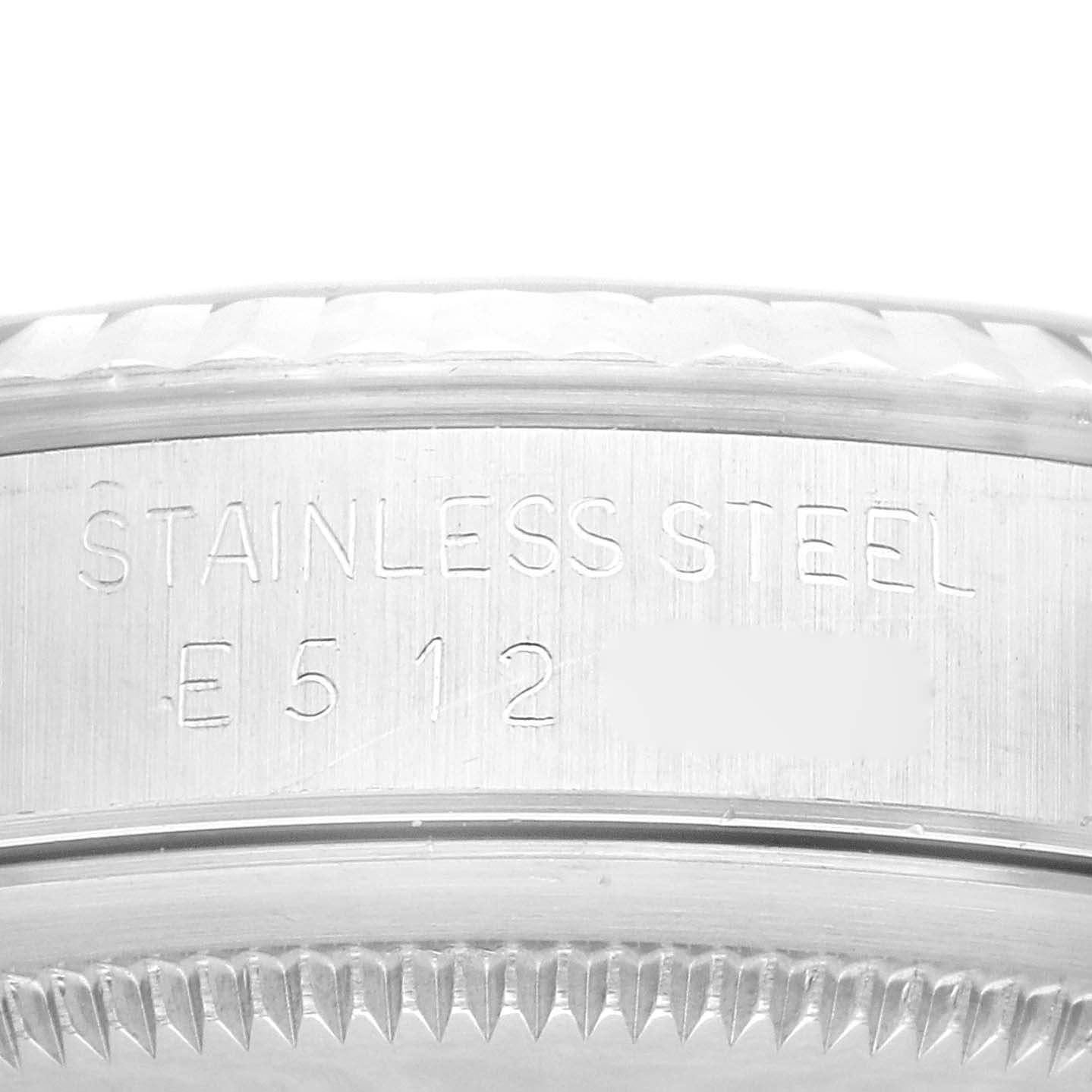 This image shows a close-up side view of the stainless steel case with serialized engraving for the Rolex Datejust 16234 Men's Stainless Steel Black Dial 16234 Men's Stainless Steel Black Dial watch.