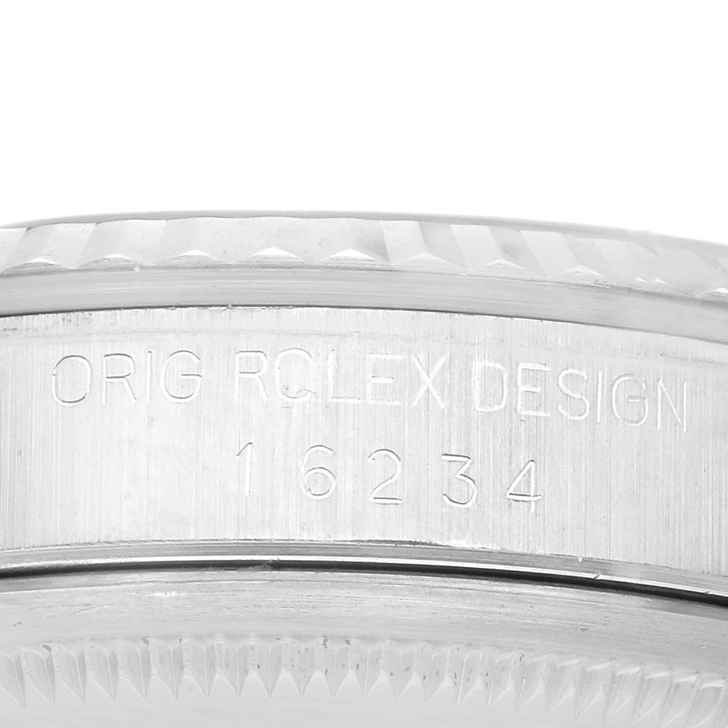 This image shows a close-up side view of the case with engravings on a Rolex Datejust 16234 Men's Stainless Steel Black Dial 16234 Men's Stainless Steel Black Dial model watch.