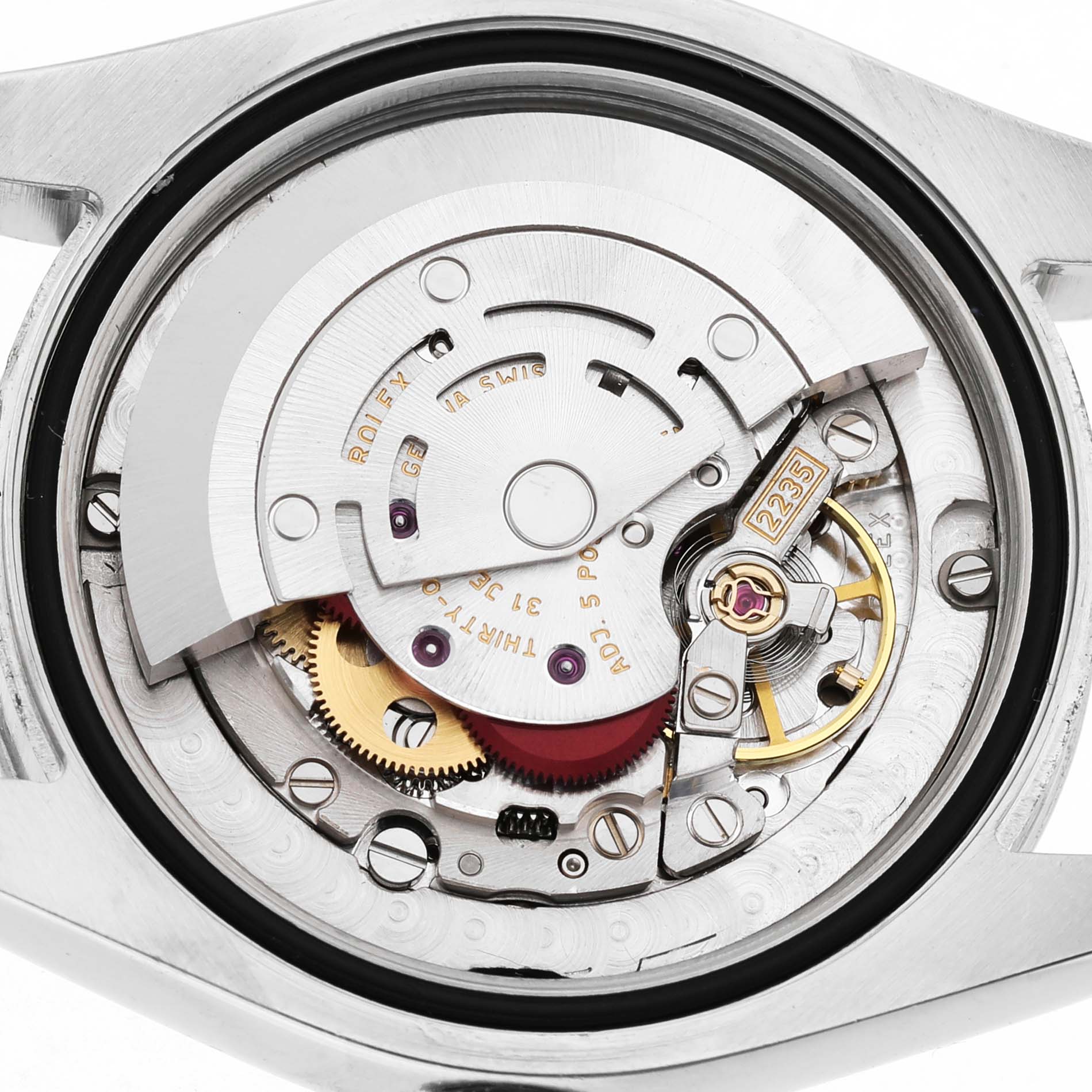 The image shows the movement of a Rolex Datejust 178240 Women's Stainless Steel Silver Dial, viewed from the back, showcasing its intricate mechanics and rotor.