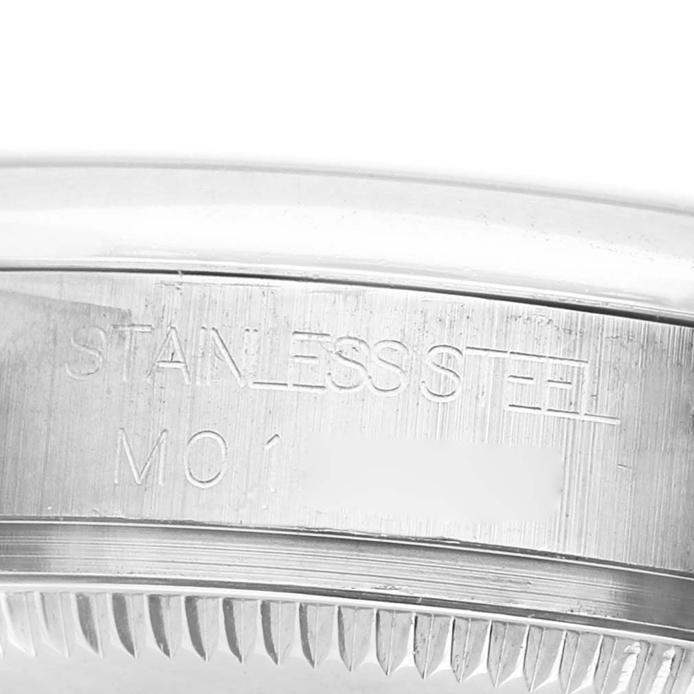 This image shows the side of the Rolex Datejust 178240 Women's Stainless Steel Silver Dial's stainless steel case with engraved markings.