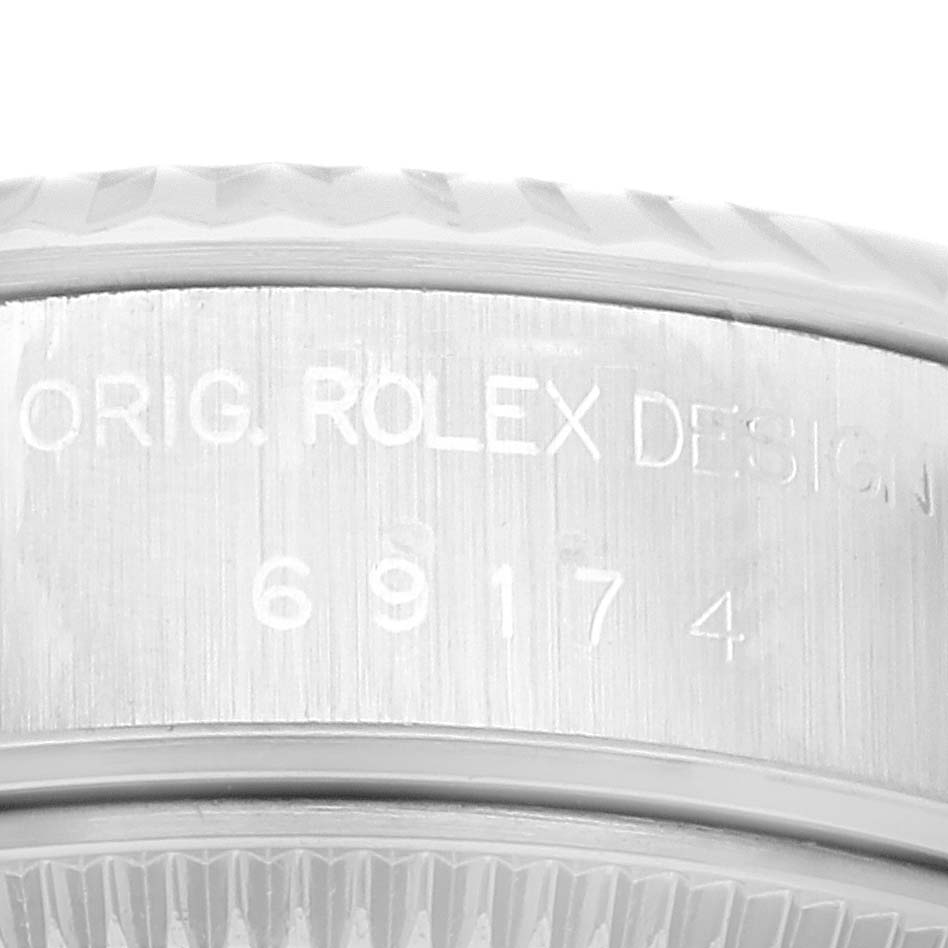 This is a close-up view of the case side of a Rolex Datejust 79174 Women's Stainless Steel Black Dial 79174 Women's Stainless Steel Black Dial, showing the engraved model number.