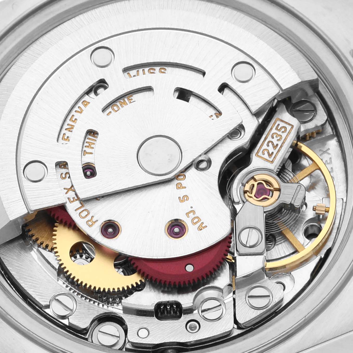 This image displays a close-up view of the movement mechanism of a Rolex Datejust 79174 Women's Stainless Steel Mother of Pearl Dial 79174 Women's Stainless Steel Mother of Pearl Dial watch, showcasing gears, screws, and engravings.