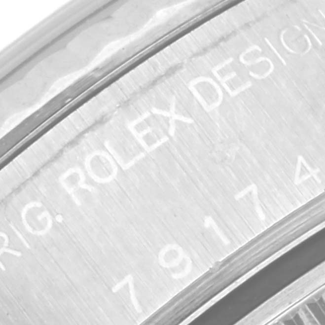 This image shows a close-up of the bezel and serial engraving on a Rolex Datejust 79174 Women's Stainless Steel Mother of Pearl Dial 79174 Women's Stainless Steel Mother of Pearl Dial watch.