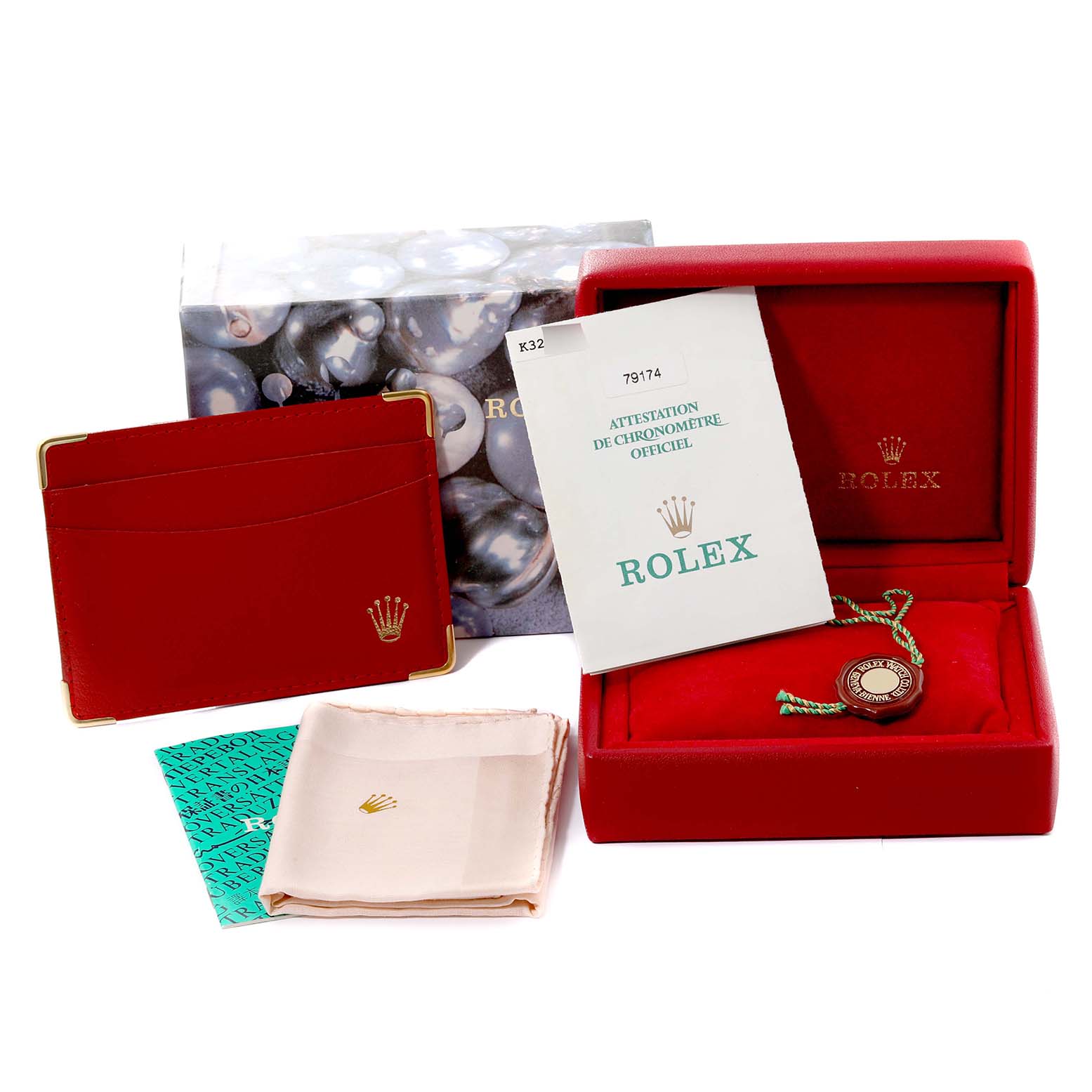 The image shows the packaging, manual, warranty card, and accessories for a Rolex Datejust 79174 Women's Stainless Steel Mother of Pearl Dial 79174 Women's Stainless Steel Mother of Pearl Dial watch.