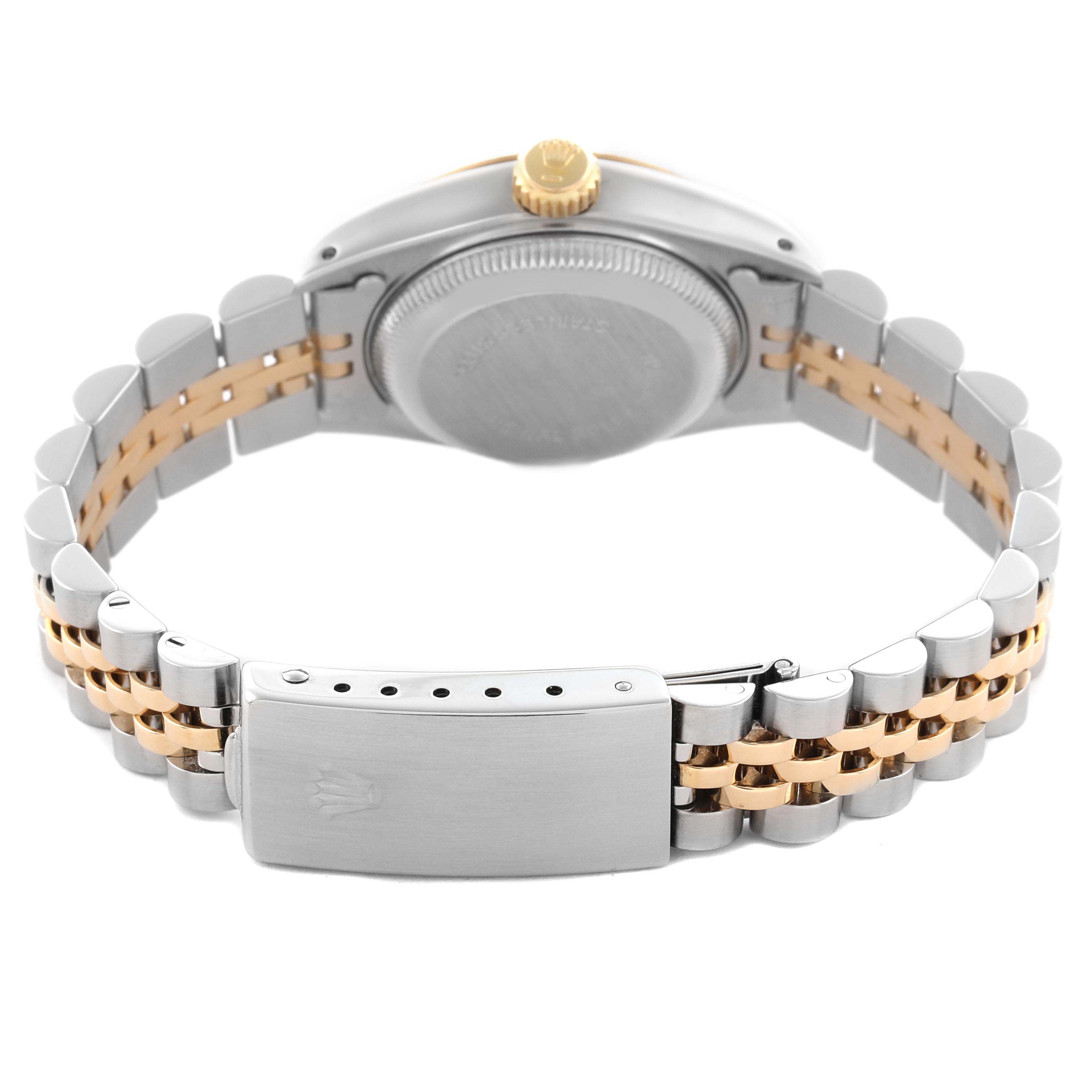 The image shows the back view of a Rolex Datejust 69173 Women
s Steel and Gold (two tone) Champagne Dial 69173 Women
s Steel and Gold (two tone) Champagne Dial watch, highlighting the clasp, bracelet, and case back.